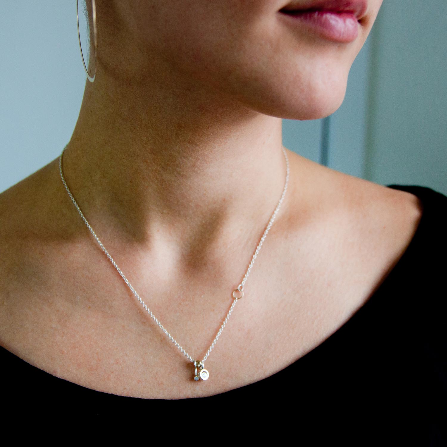 Jane Hollinger: SS Necklace w/ One .05ct Diamond in Double Bezel .03ct Diaomnd in 14k & SS Stick Piece 14k Accent ings