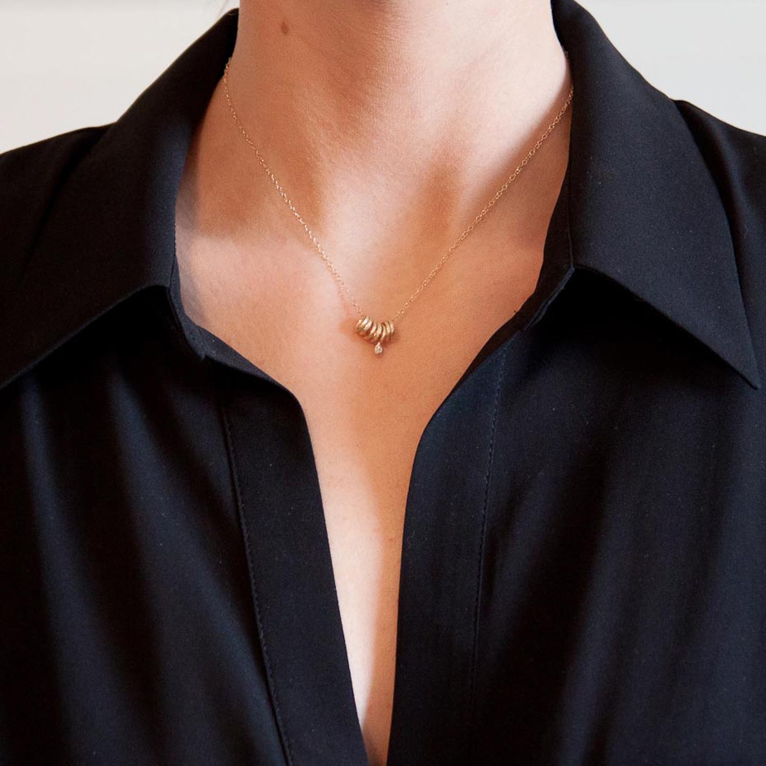 Victoria Cunningham: Necklace, 7 Rings, 1 Diamond Drop, 14K yellow gold.