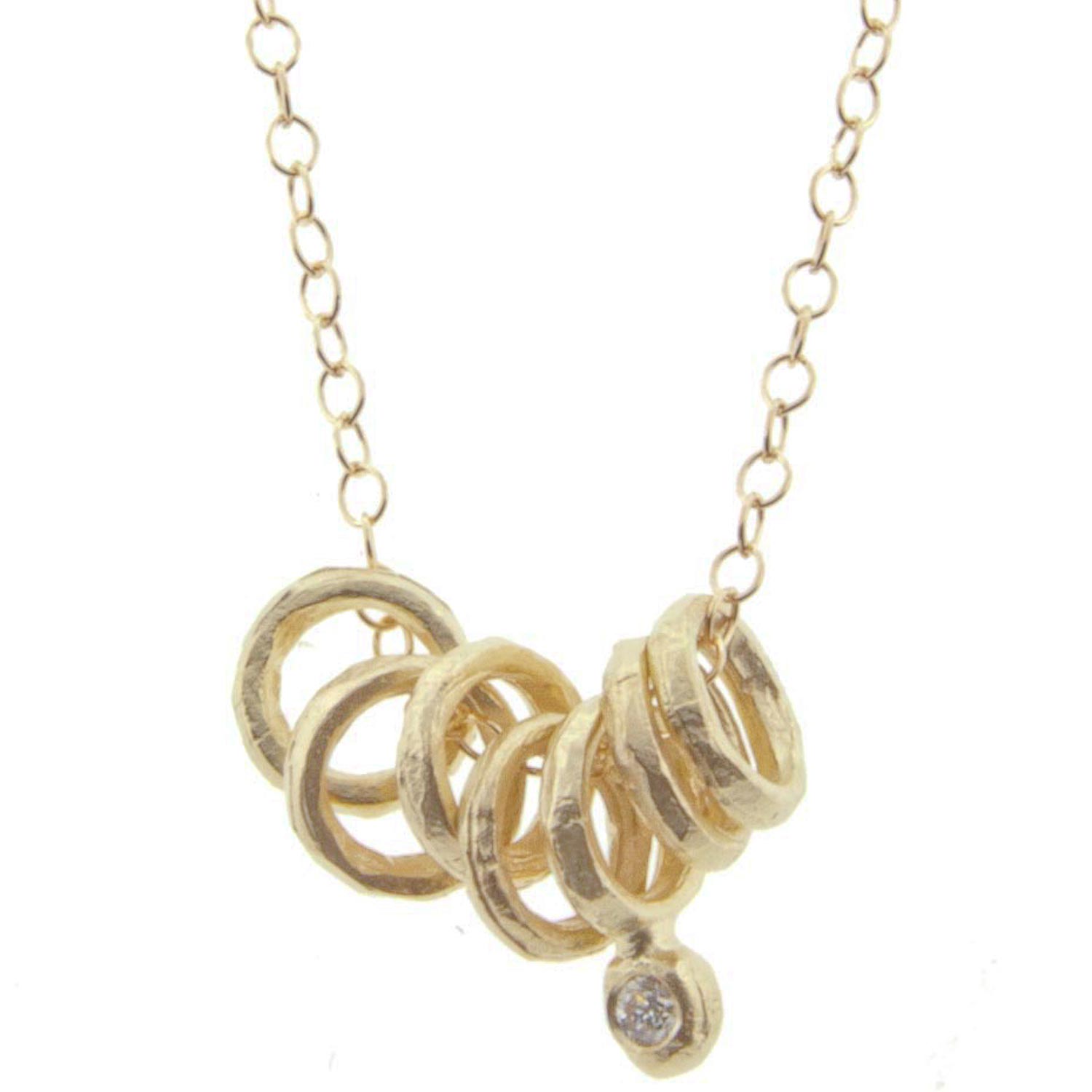 Victoria Cunningham: Necklace, 7 Rings, 1 Diamond Drop, 14K yellow gold.