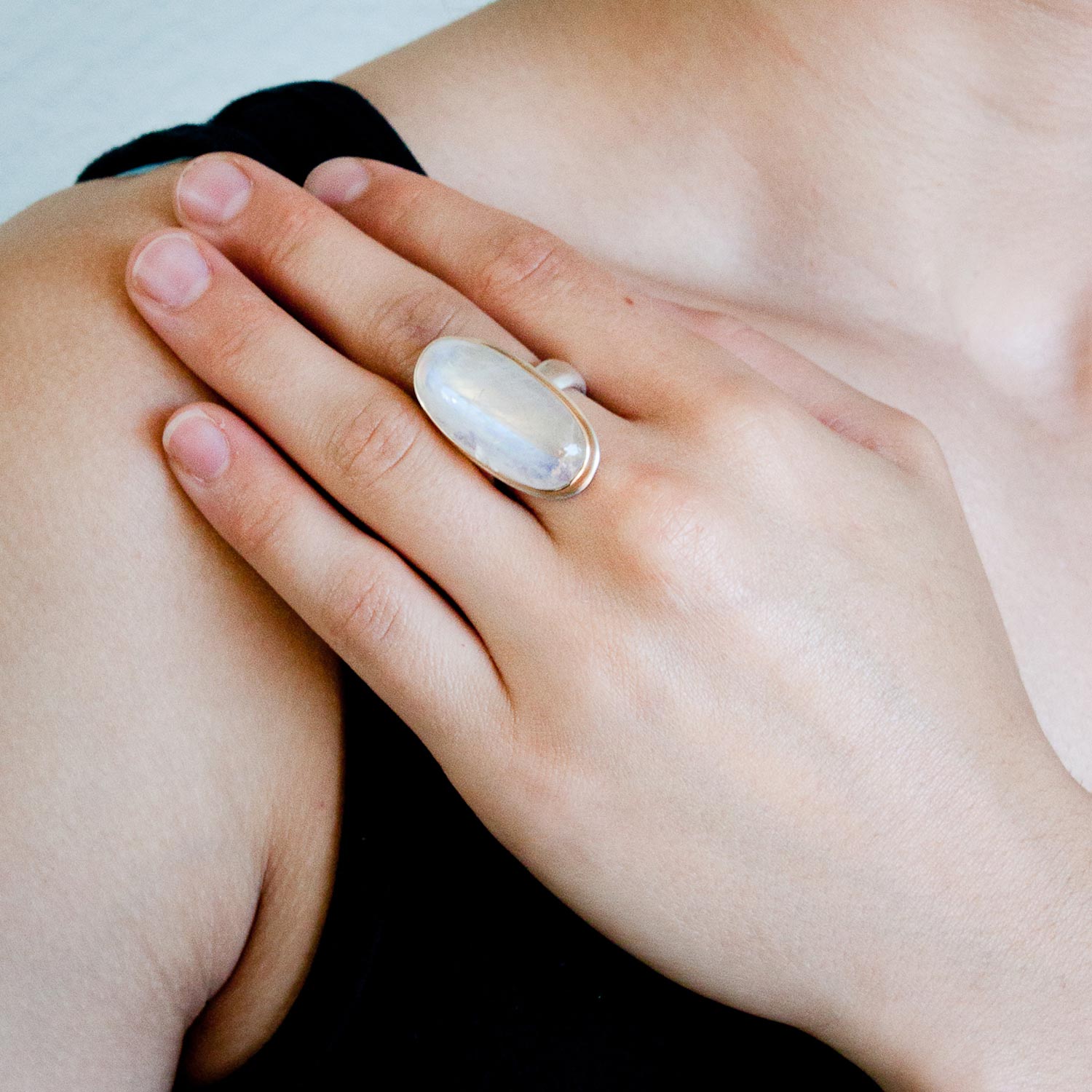 Jamie Joseph: SS & 14k Gold Ring w/ Open Back Vertical Oval Smooth White Moonstone on Groovy Band