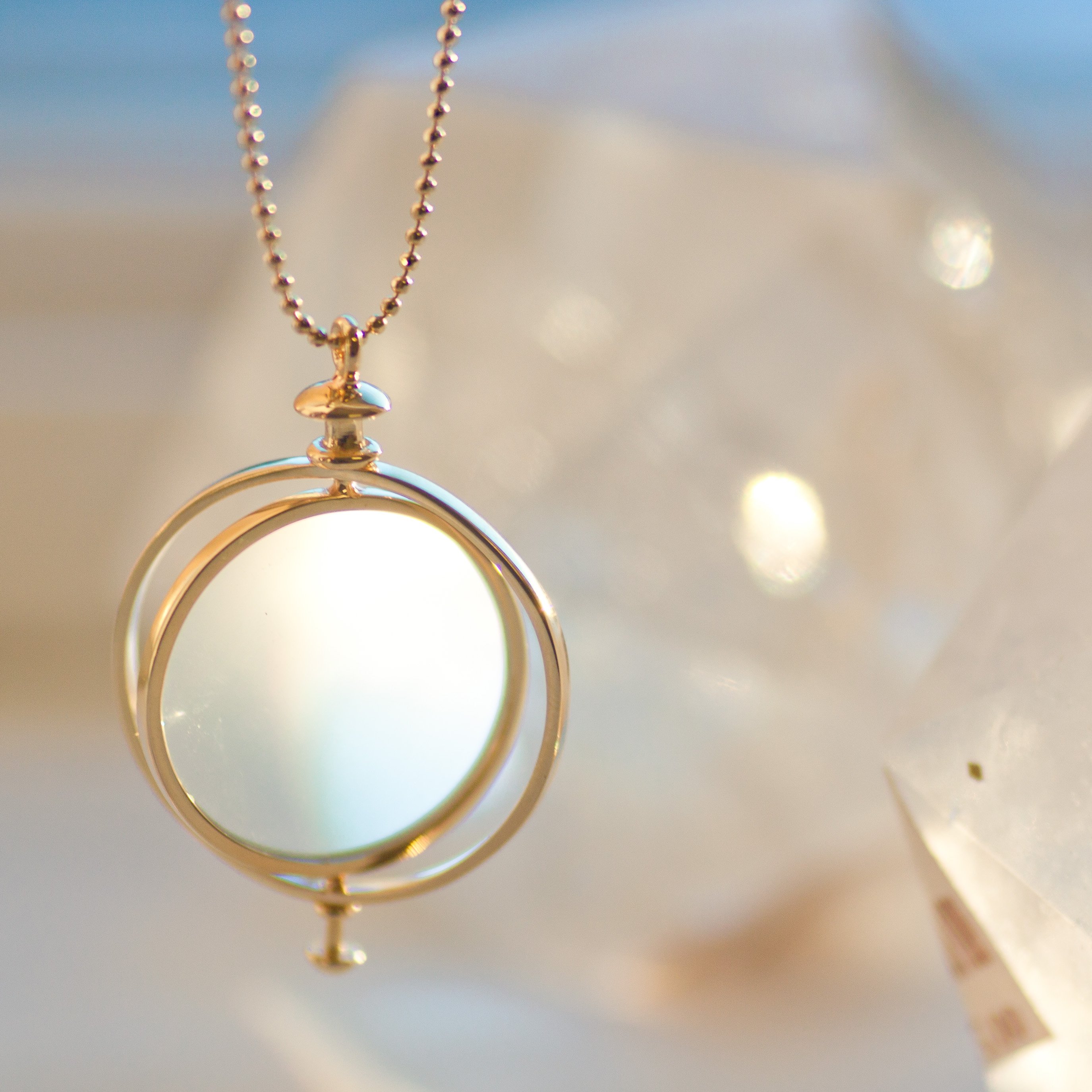 Kismet: Small Medallion with loop 6.09gr 14K gold .09ct white diamond