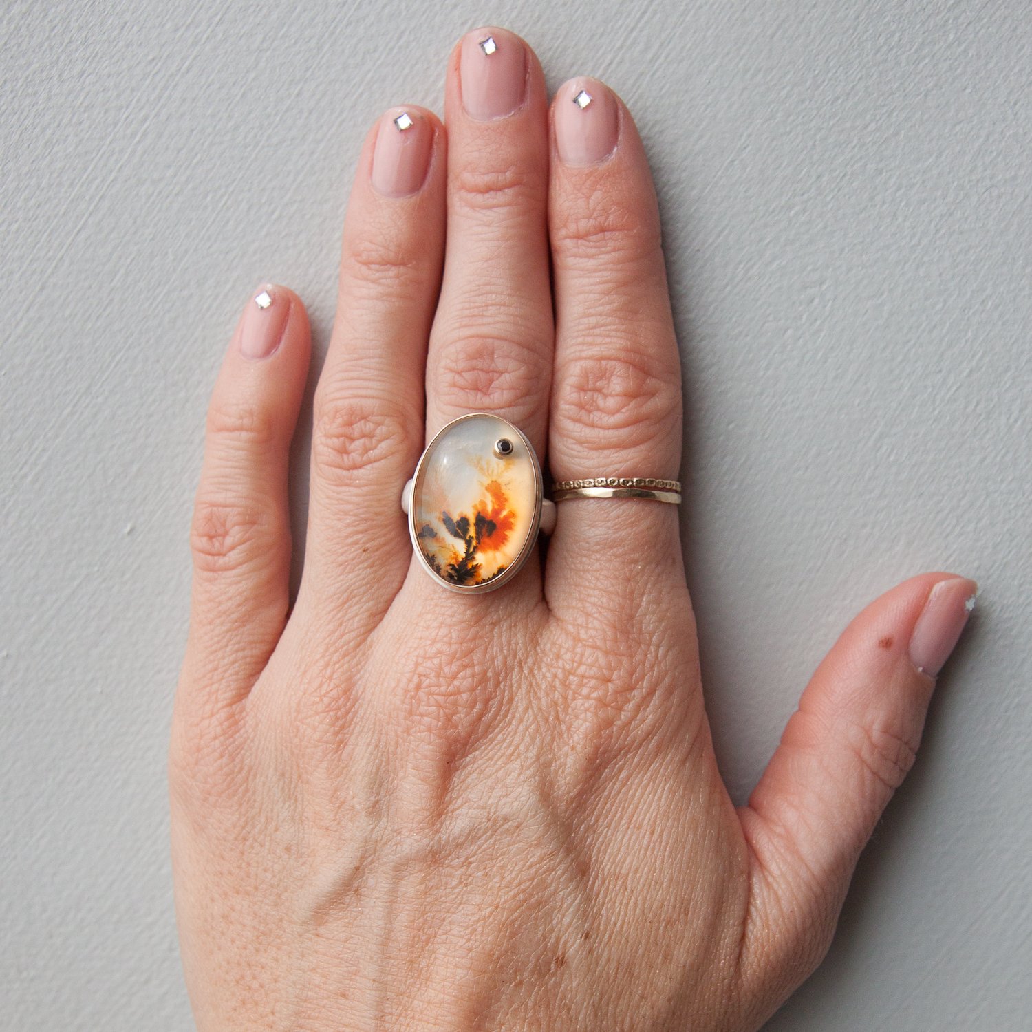 Jamie Joseph: SS & 14k gold ring with vertical oval smooth dendritic agate and .03ct black diamond on groovy band size 7