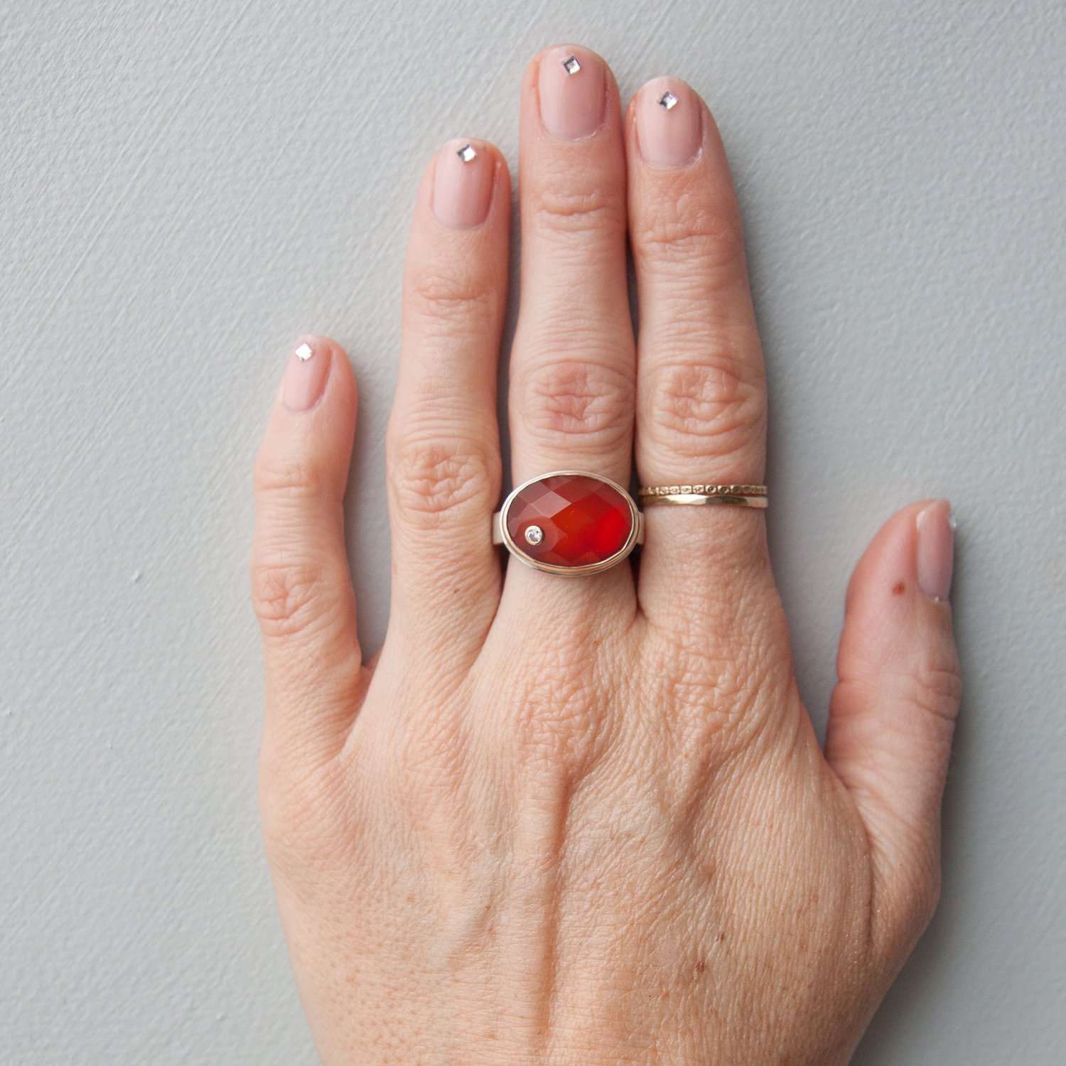 Jamie Joseph: SS & 14k gold ring with oval checkerboard carnelian and .03ct diamond on live edge band