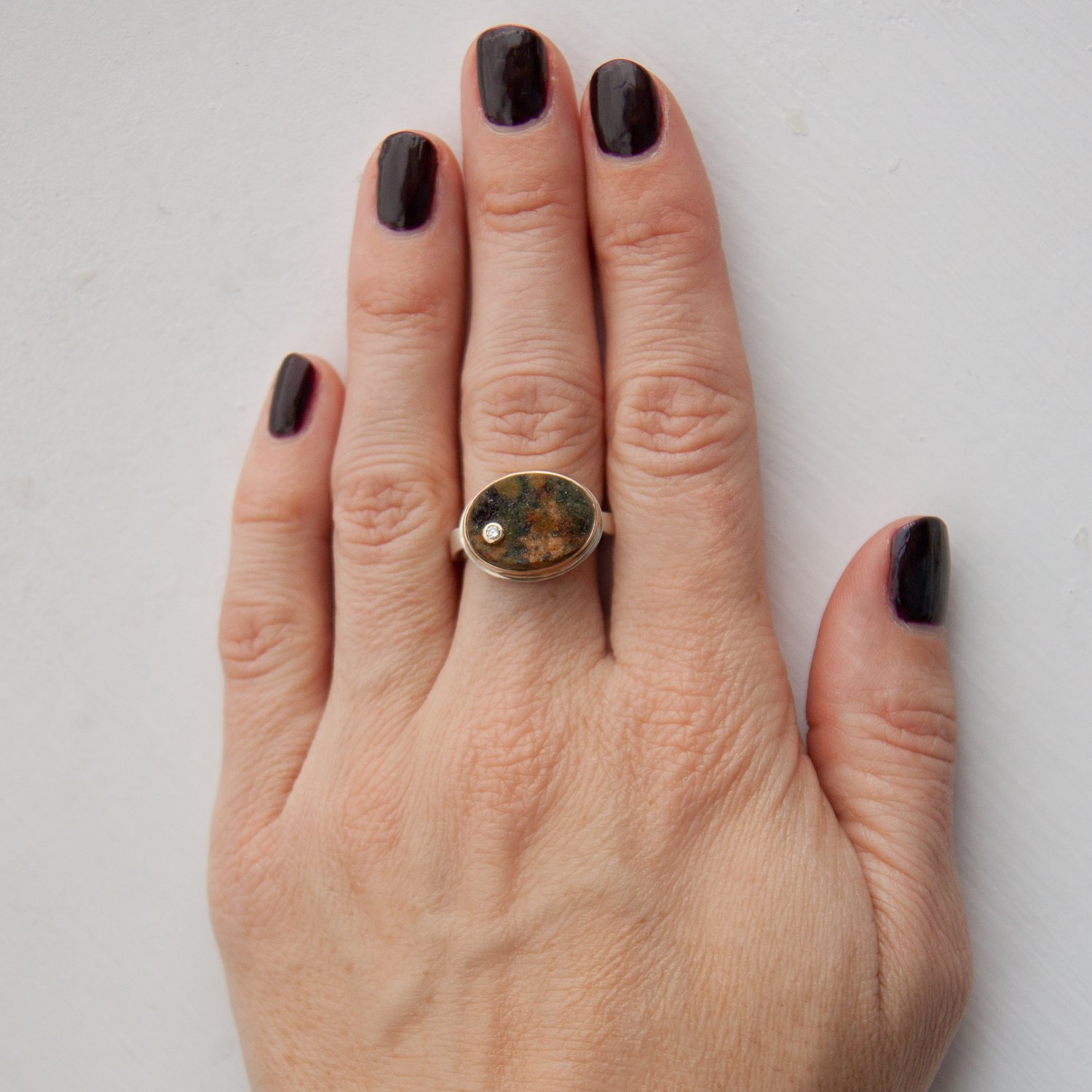 Jamie Joseph: SS & 14k gold ring with small oval Turkish green druzy and .03ct diamond on medium live edge band