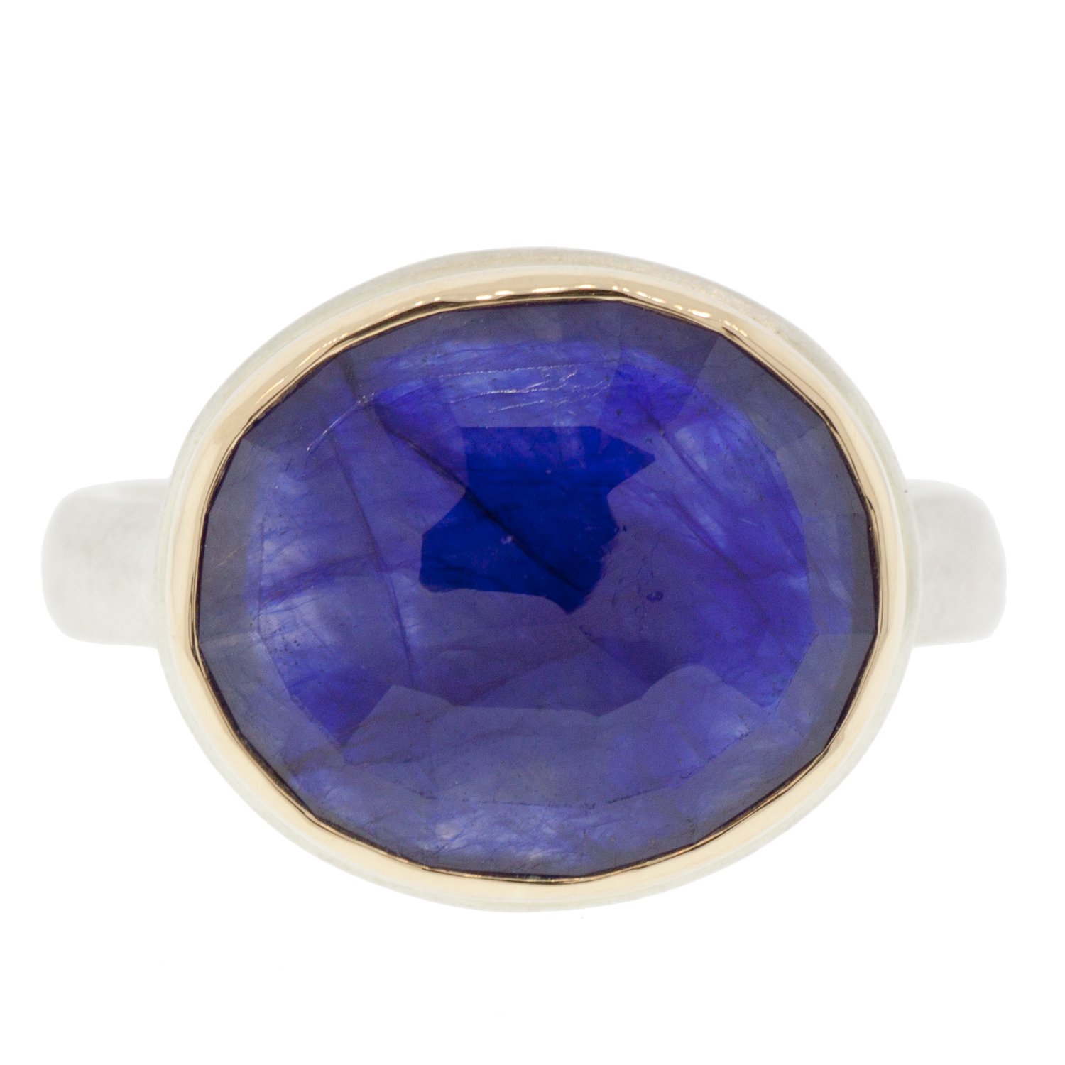 Jamie Joseph: SS & 14k gold ring with oval faceted blue sapphire on organic band