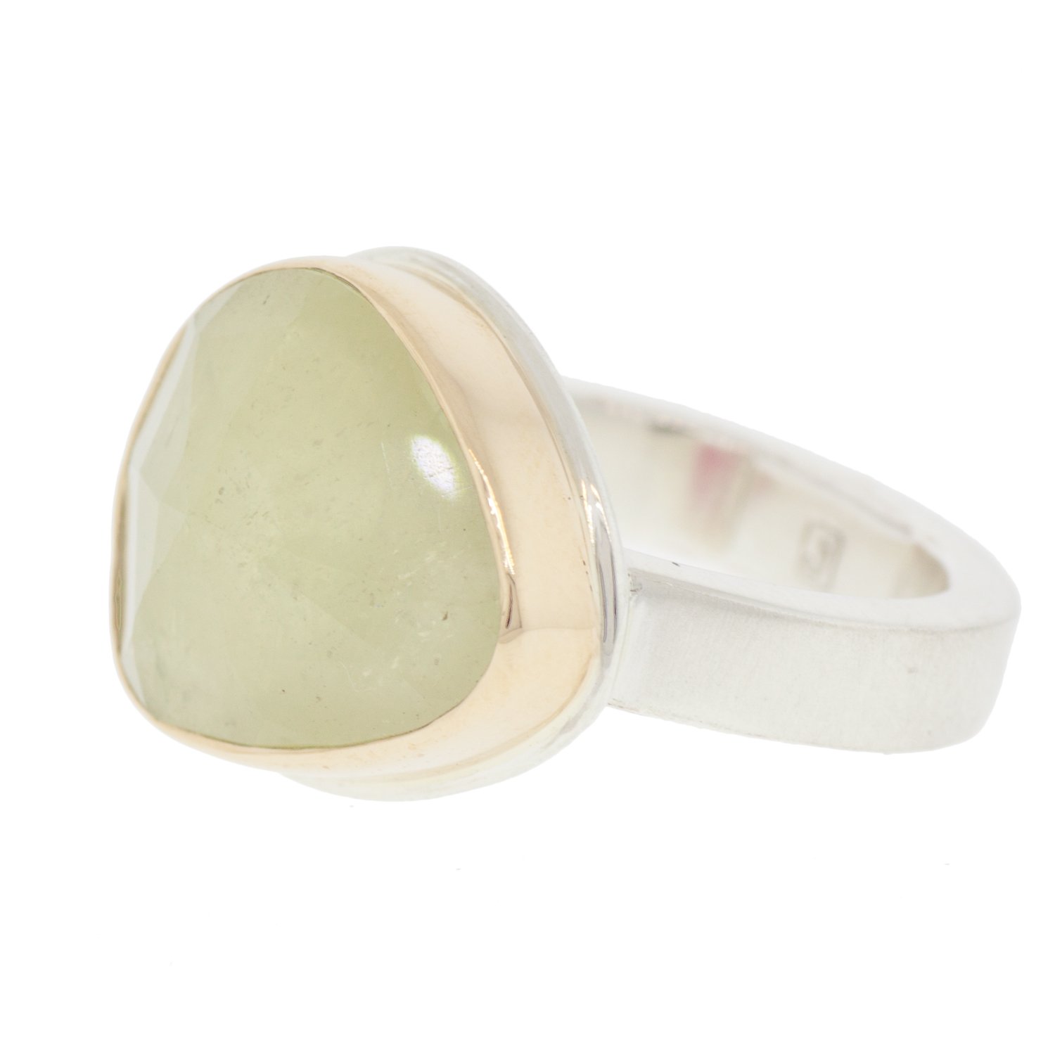 Jamie Joseph: SS & 14k gold ring with asymmetrical random faceted linen sapphire on skinny smooth band