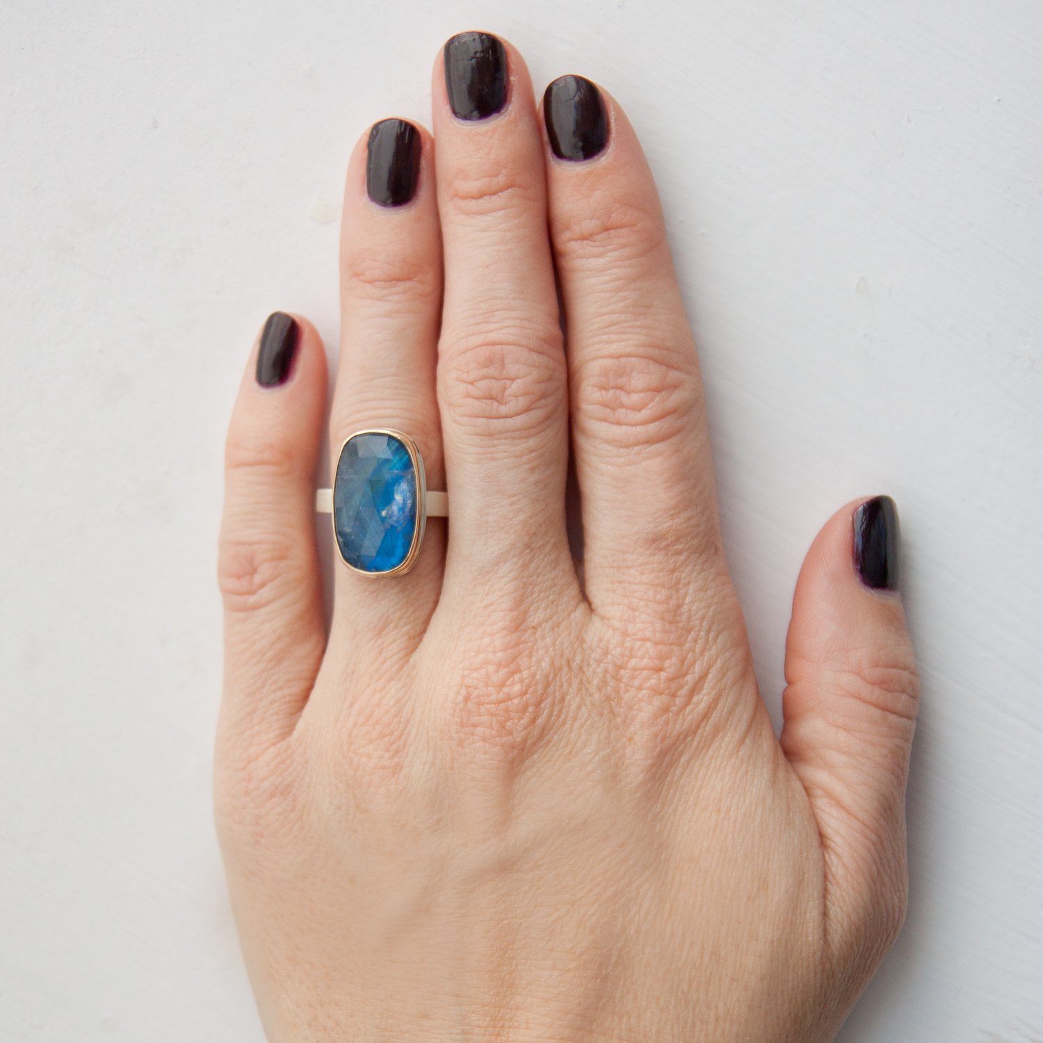 Jamie Joseph: SS & 14k gold ring with rectangular rose cut rainbow moonstone on X band