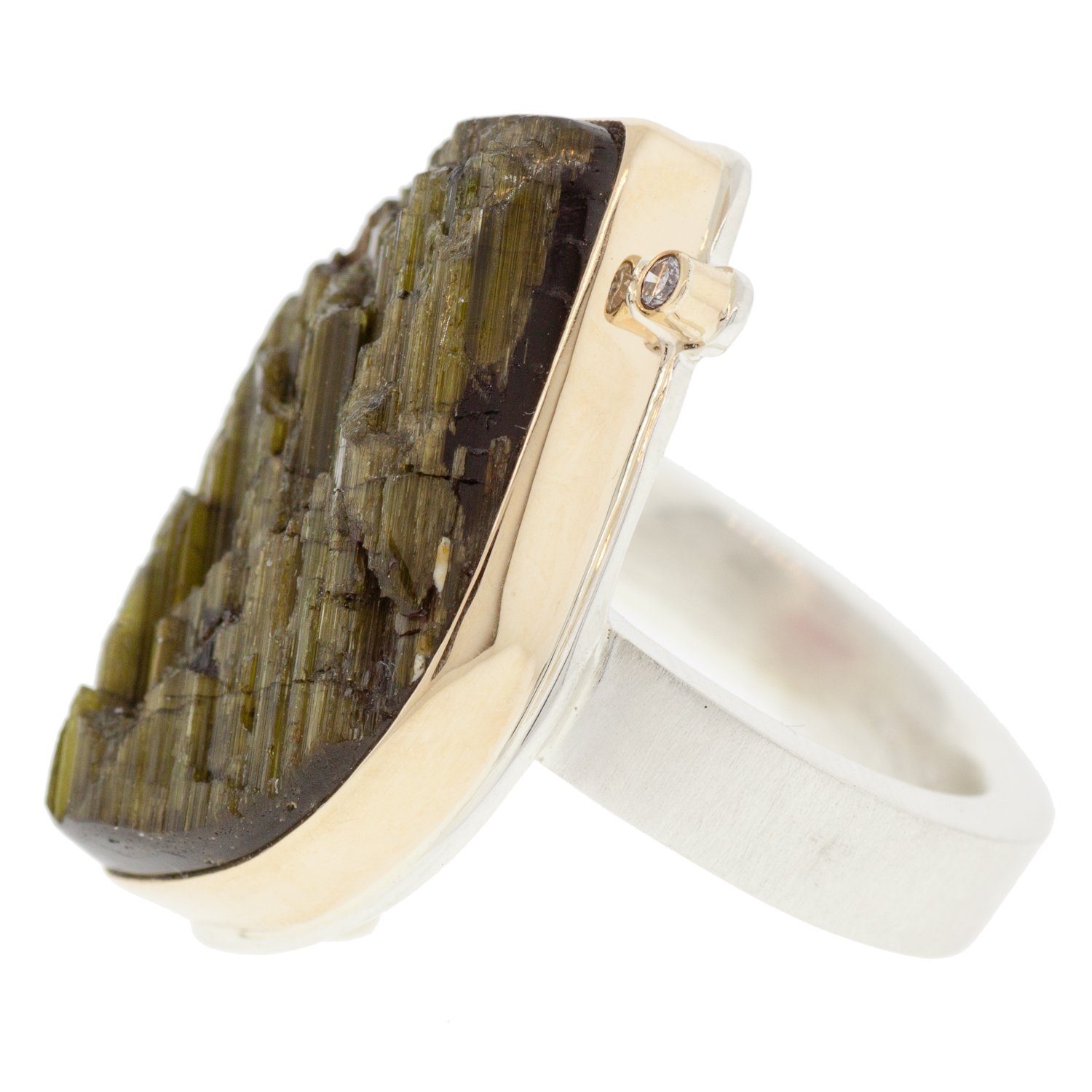 Jamie Joseph: SS & 14k gold ring with vertical asymmetrical surface cut green tourmaline and .025ct satellite diamond on Y band