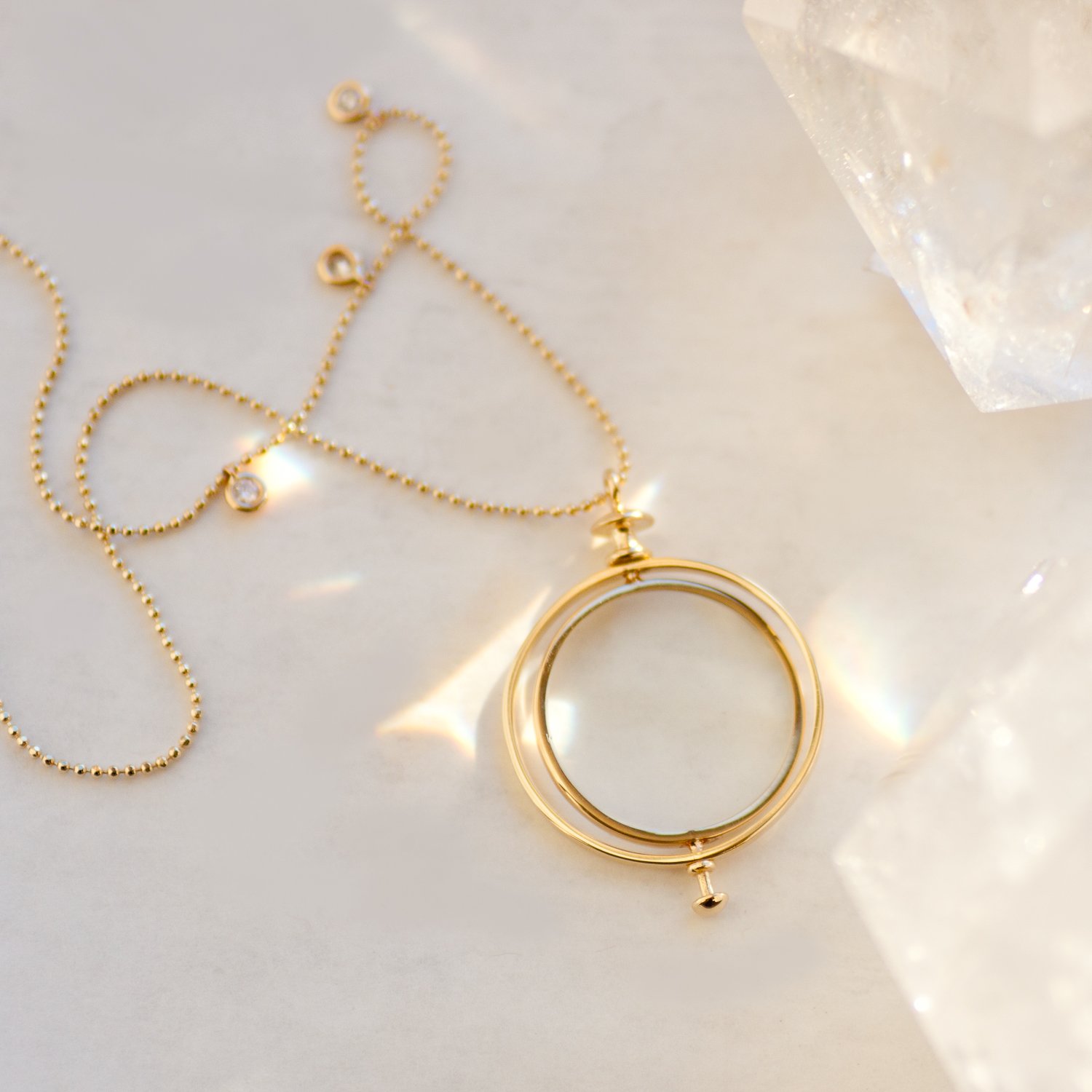 Kismet: Small Medallion with loop 6.09gr 14K gold .09ct white diamond