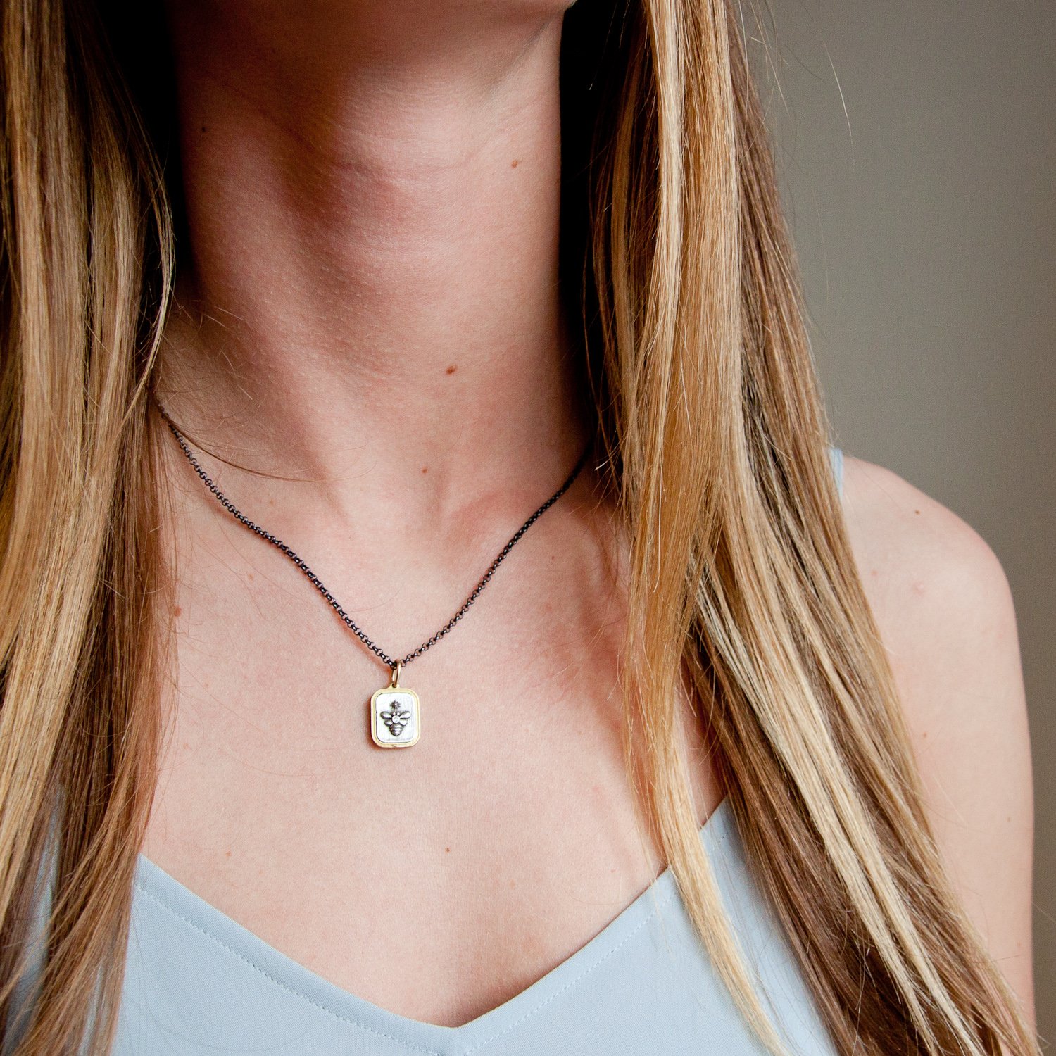 Erica Molinari Trunk Show: ss and 18k diamond bee and initial "F" .013cts