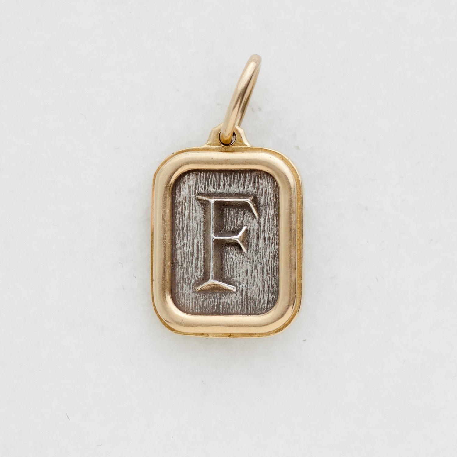 Erica Molinari Trunk Show: ss and 18k diamond bee and initial "F" .013cts