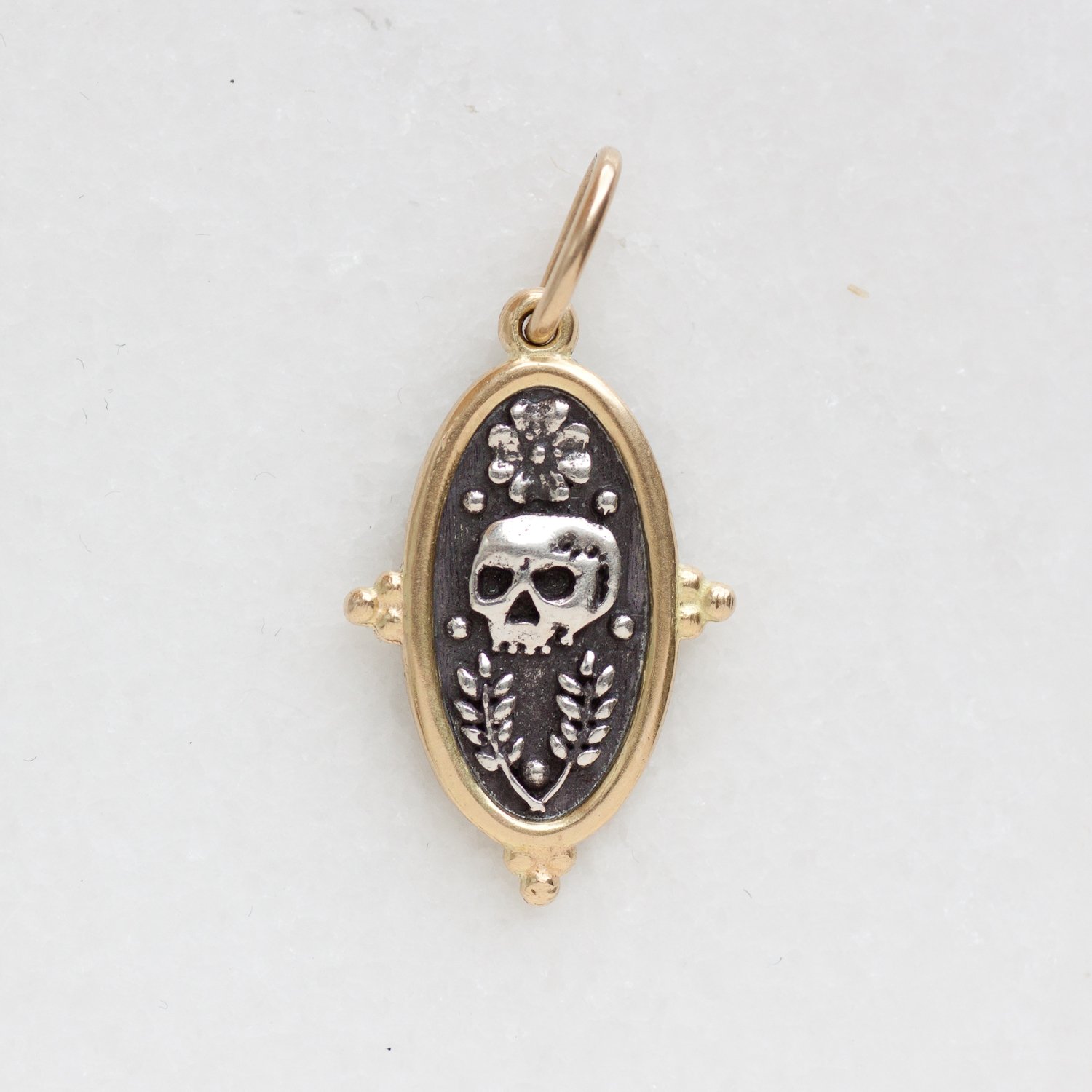 Erica Molinari Trunk Show: ss and 18k baby skull, vines and cross