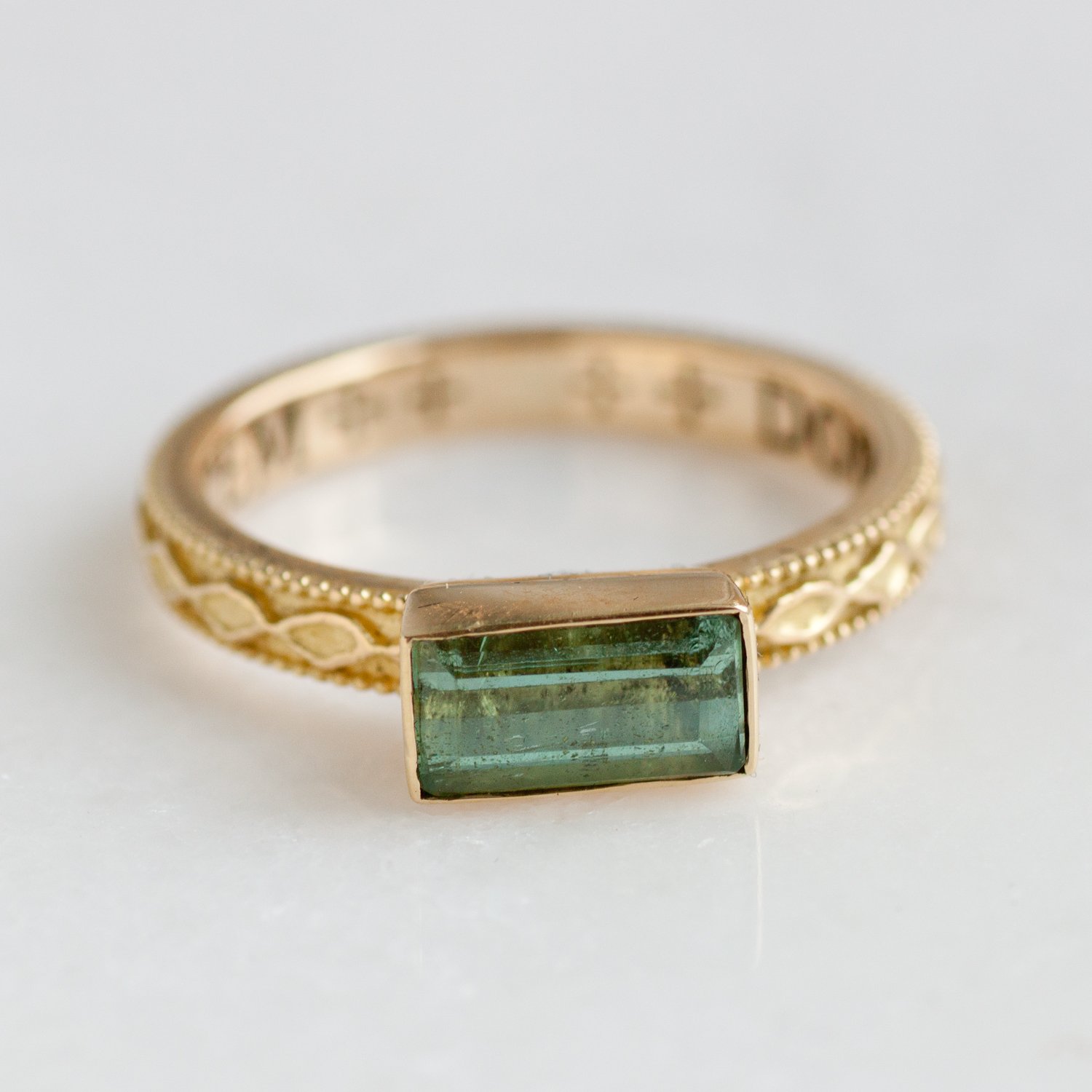 Erica Molinari Trunk Show: 18k grn tourm ring on diamond pattern band