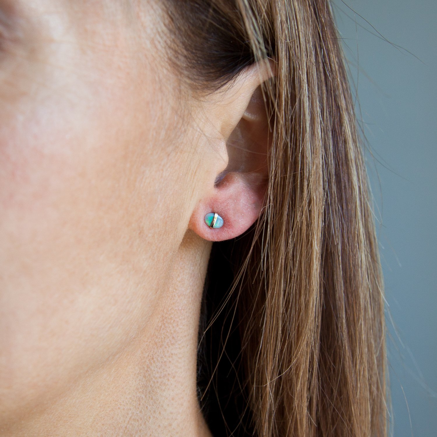 Melissa Joy Manning: Limited edition 14K yellow gold green tanzanite and opal mismatched post earrings