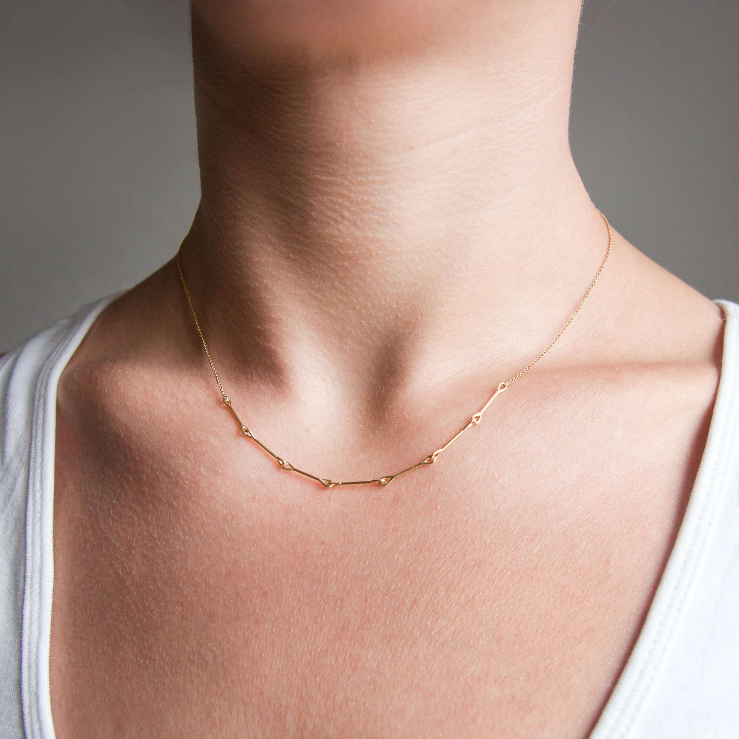 Tura Sugden: 18K yellow gold needle eye pendant necklace