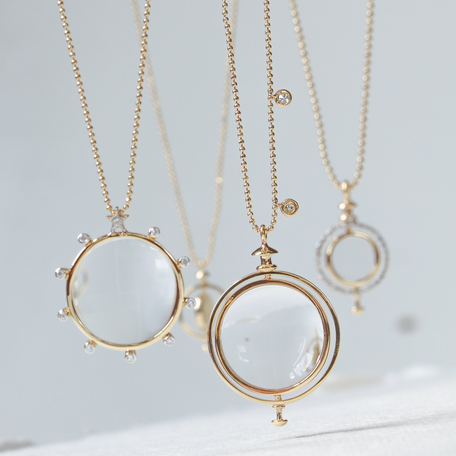 Kismet: Small Medallion with loop 6.09gr 14K gold .09ct white diamond