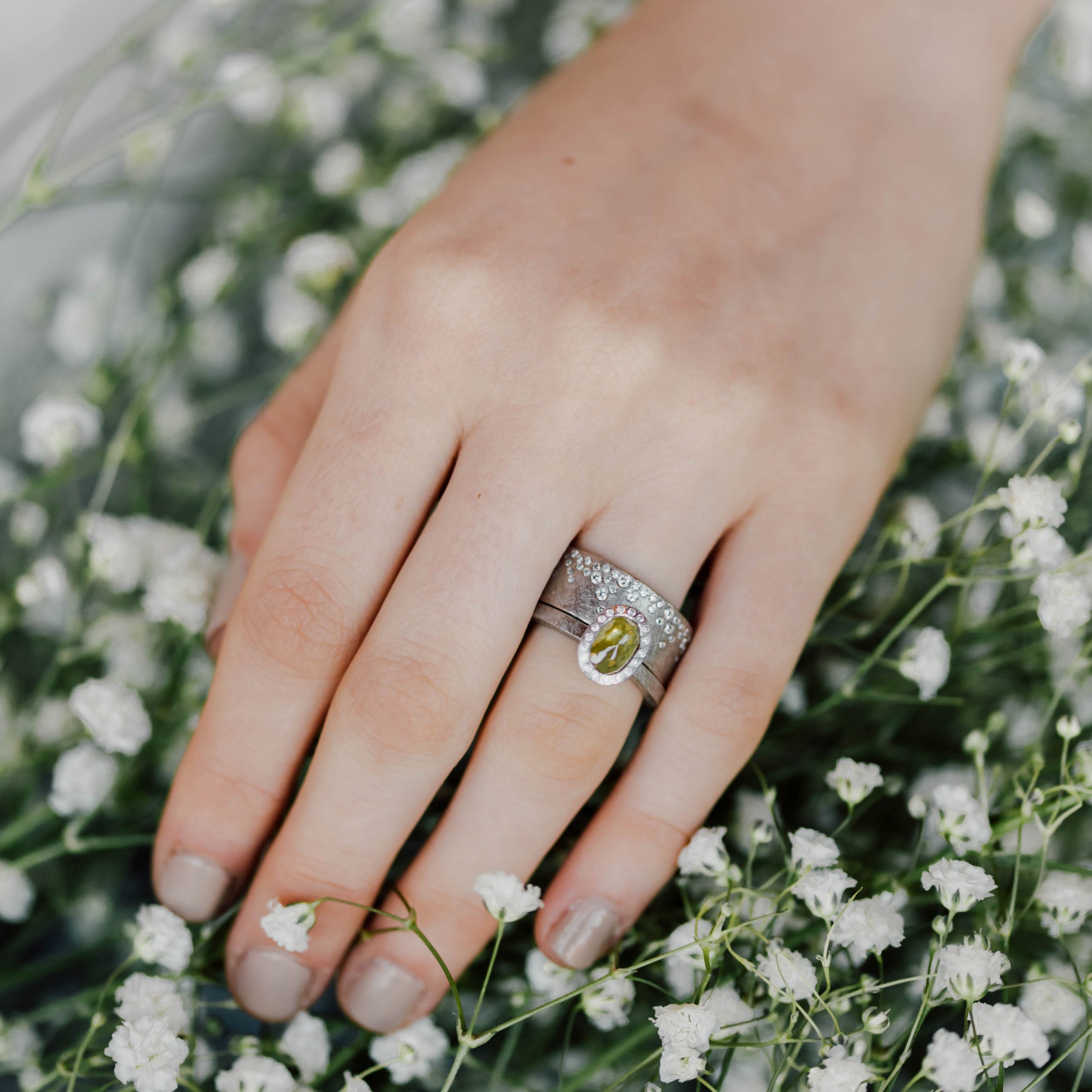 Todd Reed: Palladium, white brilliants (aprox .64 ctw) flush set diamond band