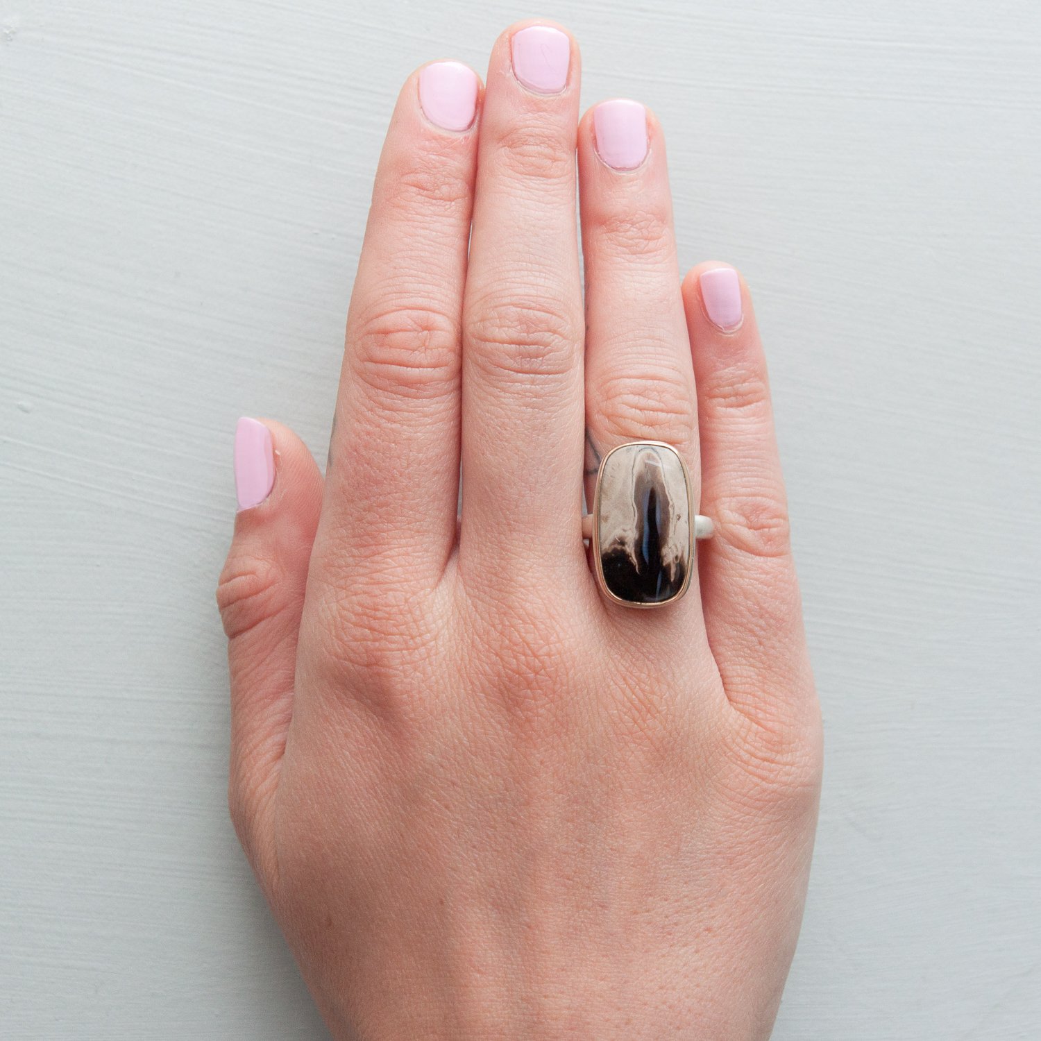 Jamie Joseph: SS & 14k gold ring with vertical rectangular smooth fossilized palm wood on organic band size 6.5
