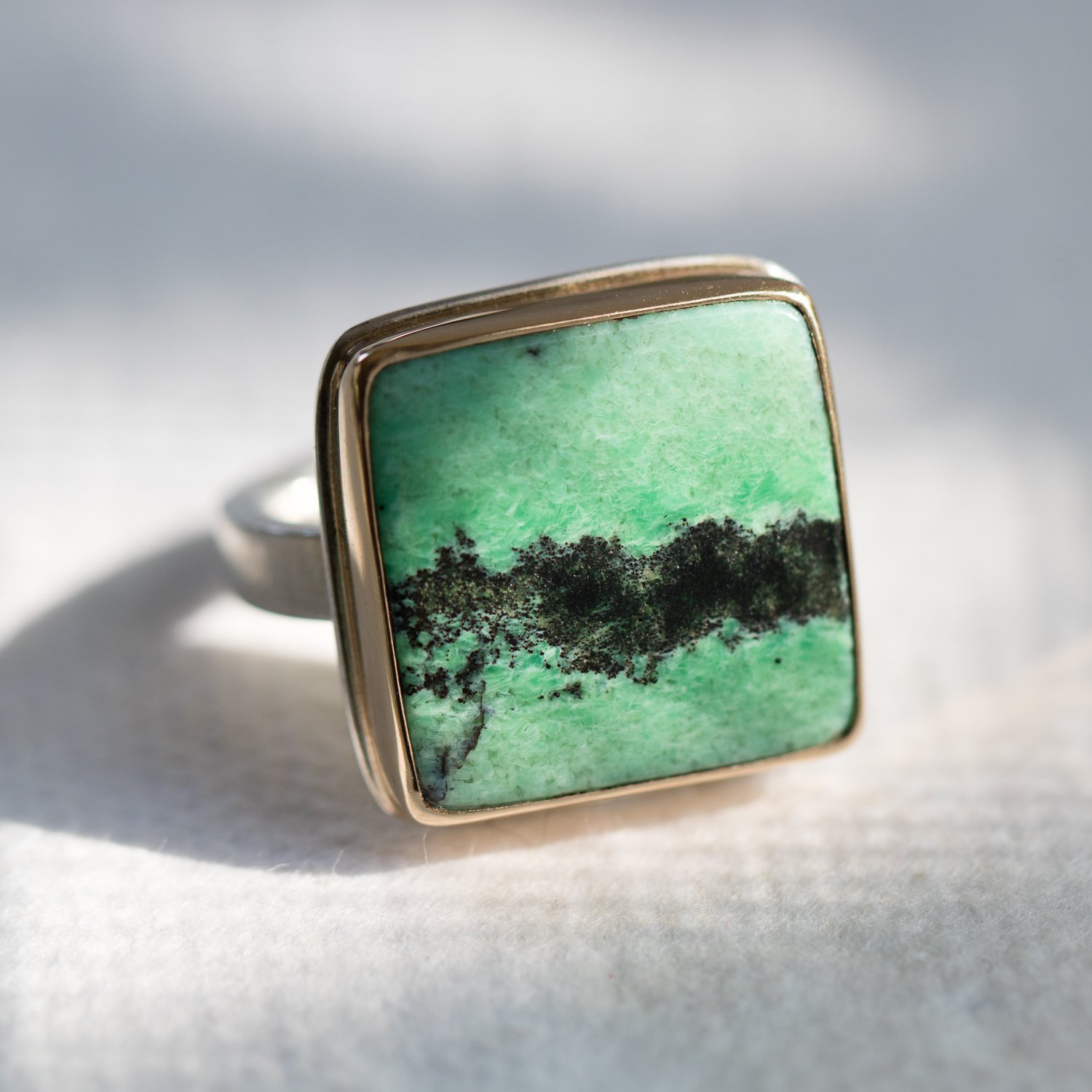 Jamie Joseph: SS & 14k Gold Ring w/ Square Smooth Grossular Garnet on X band
