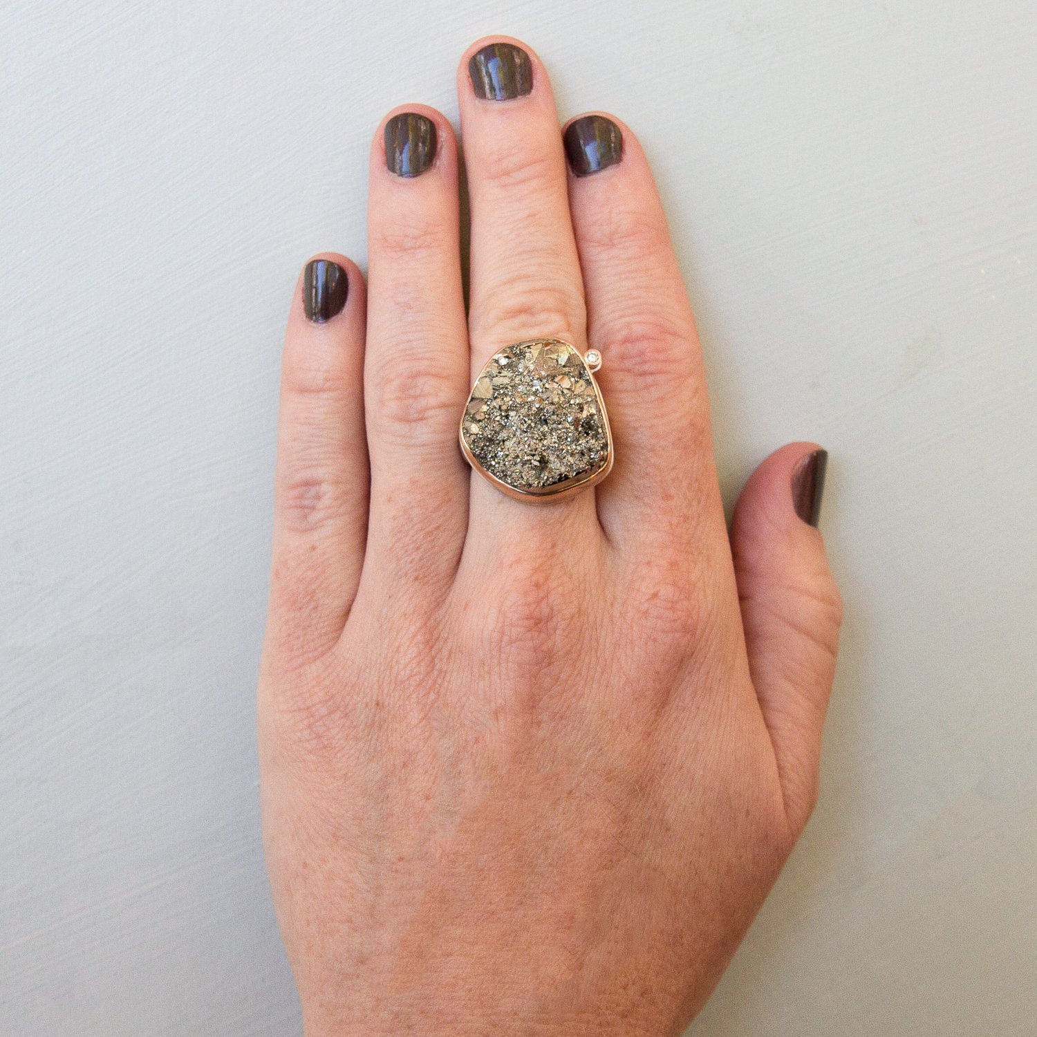 Jamie Joseph: SS & 14k gold w/ open back vertical asymmetrical surface cut pyrite & .03ct diamond on groovy band