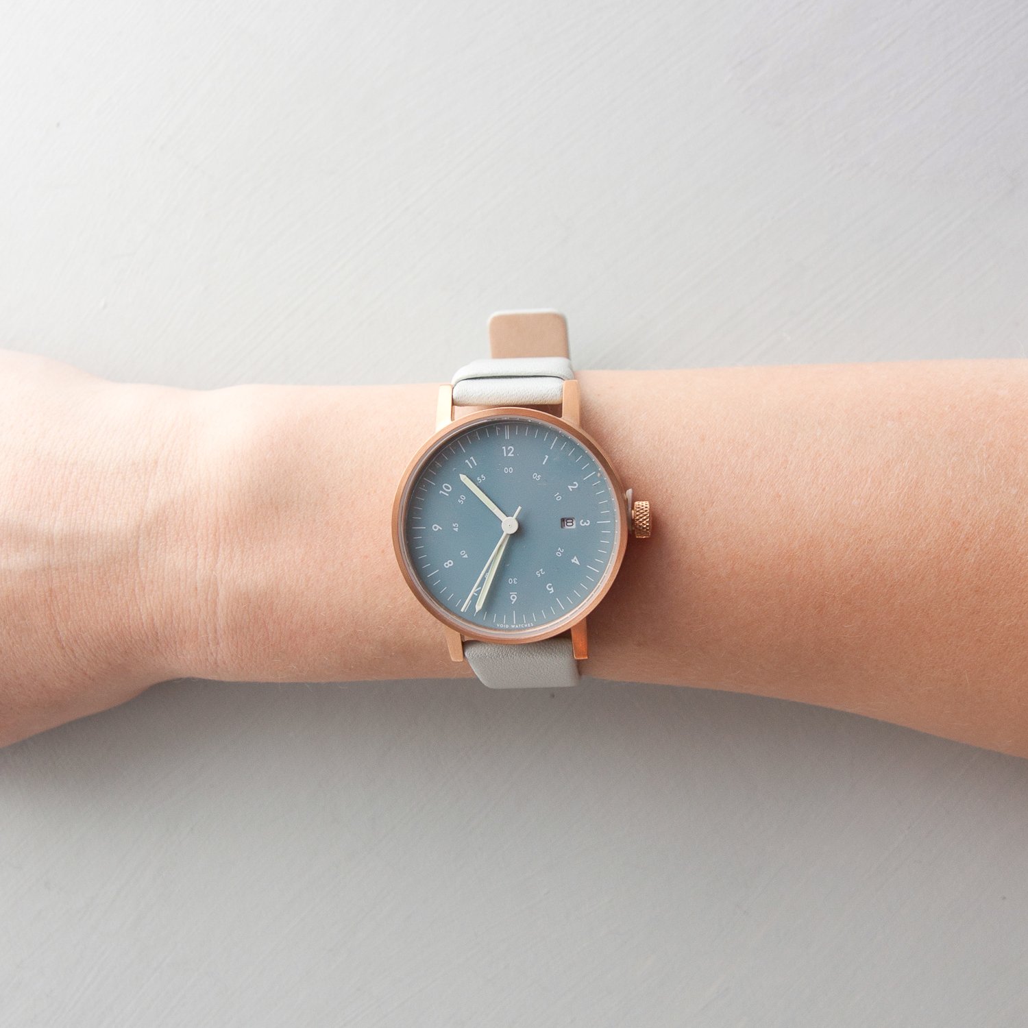 Void Watches: V03D watch with grey leather, copper case, and blue inside dial