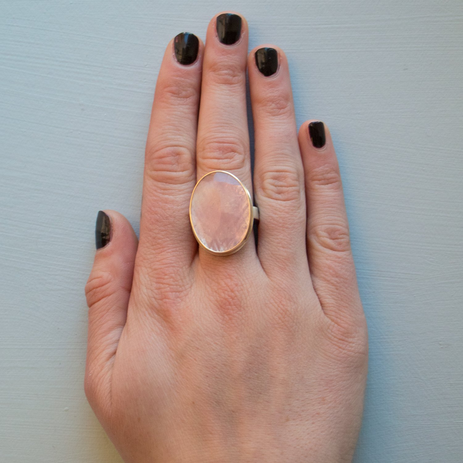 Jamie Joseph: SS & 14k gold w/ large vertical oval table cut pink sapphire on Y band