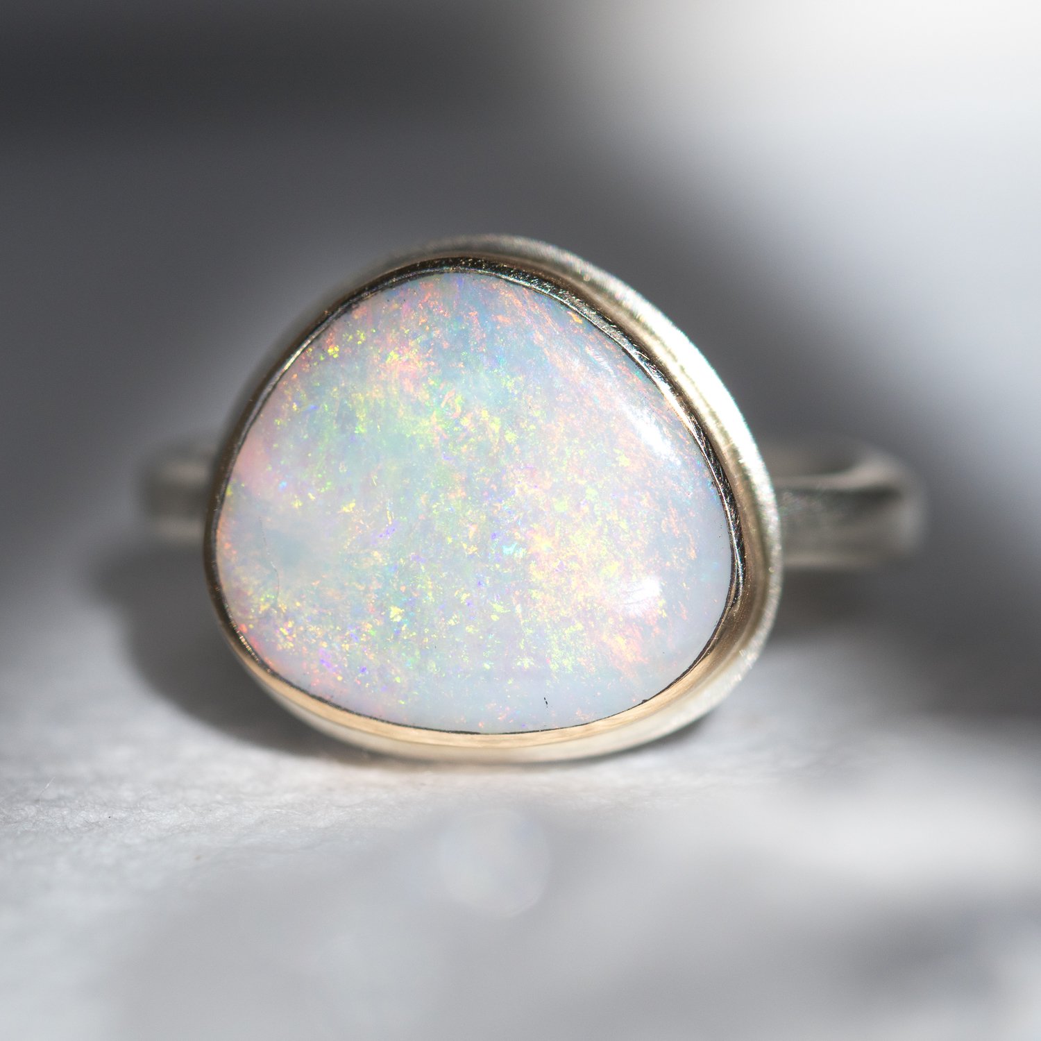 gold and silver opal ring by jewelry designer jamie joseph