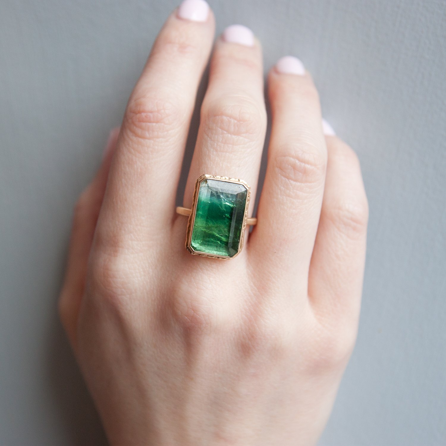 Jamie Joseph: 14k Gold Ring w/ vertical table up green tourmaline on ruffled platform