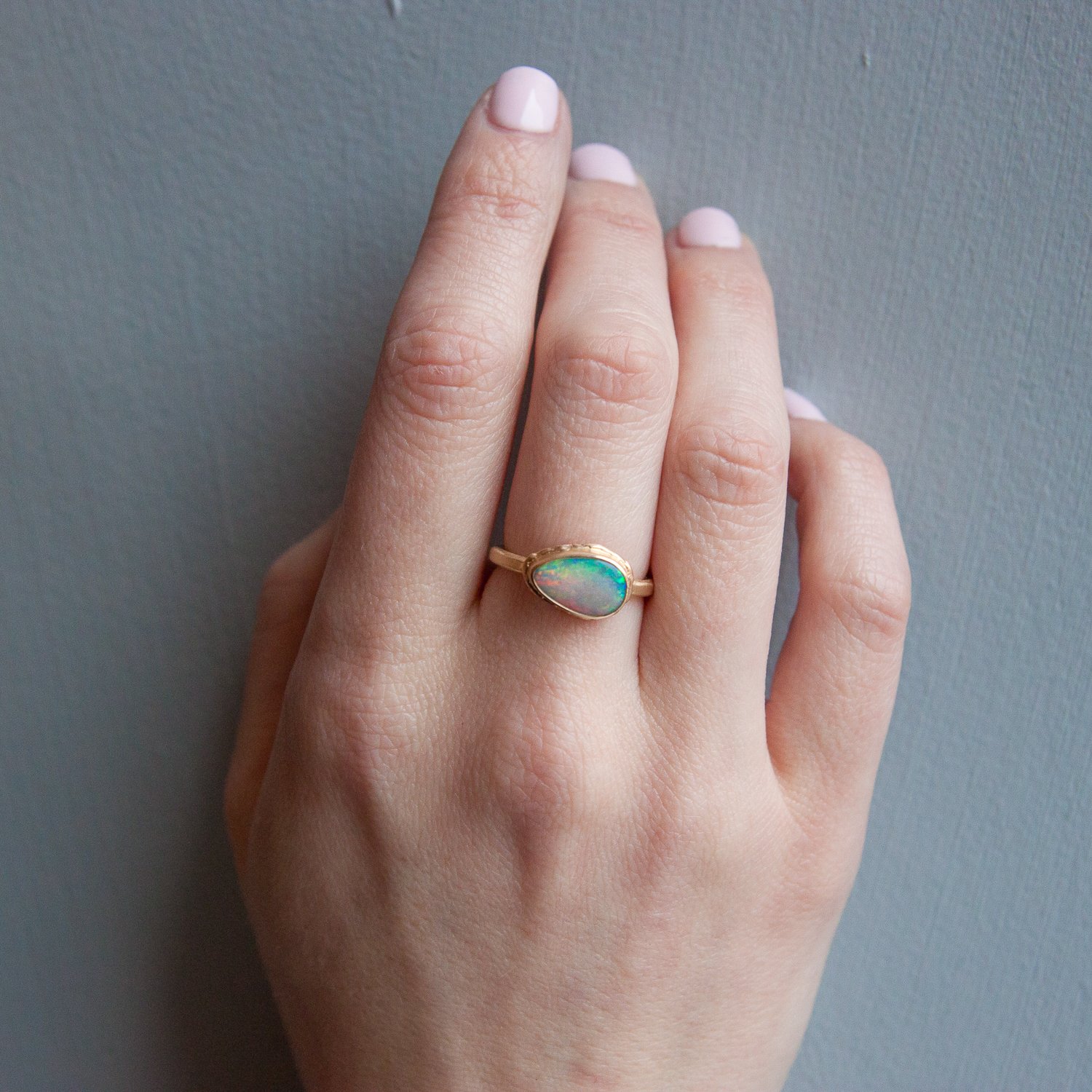 Jamie Joseph: 14k Gold Ring w/ small teardrop Australian opal on ruffled platform