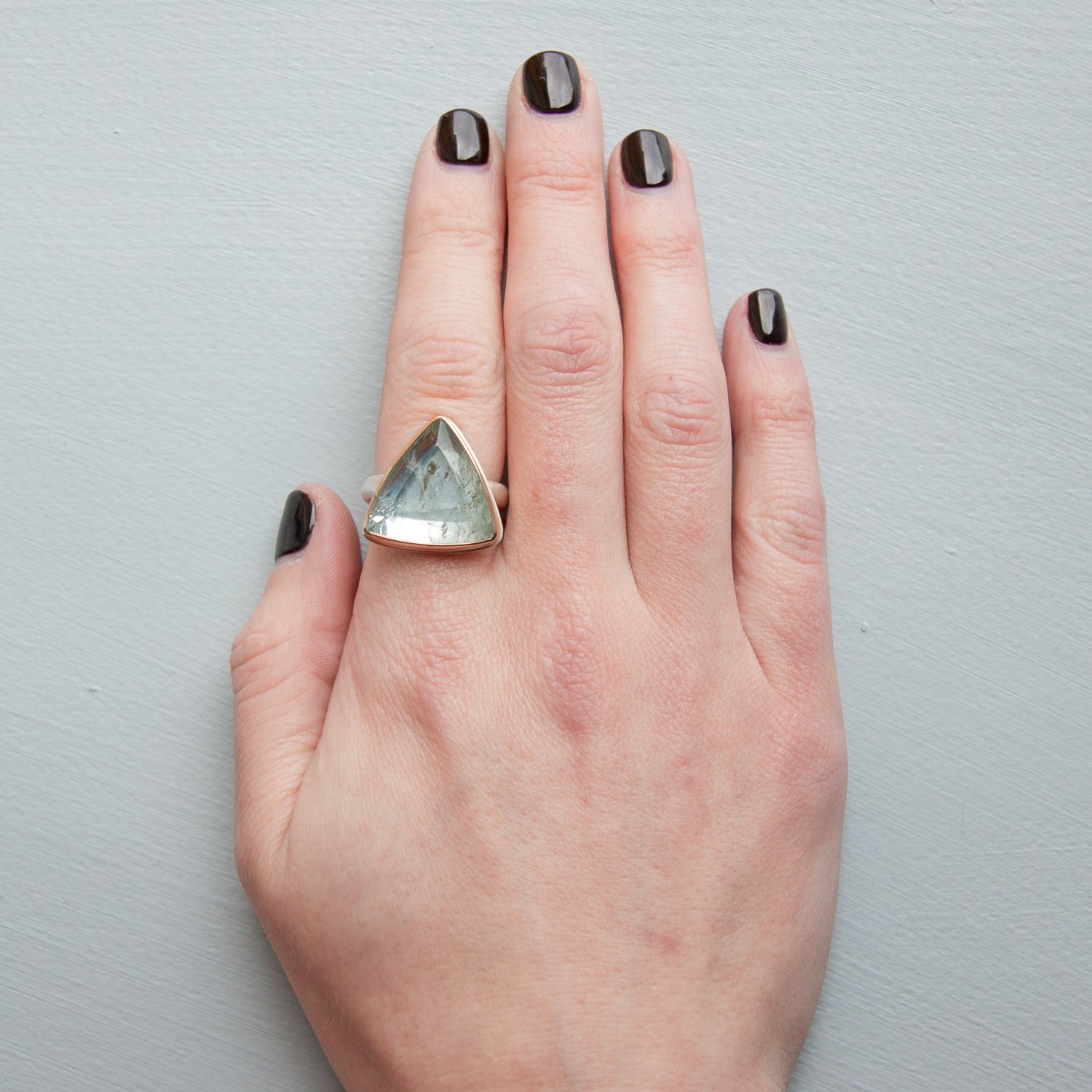 Jamie Joseph: SS & 14k Gold Ring w/ vertical triangular table up aquamarine on organic band size 7.5