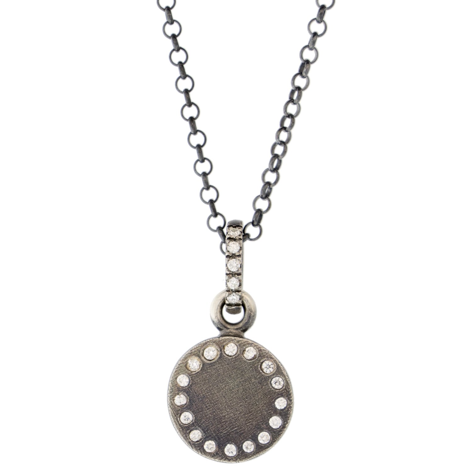 silver charm with diamonds by jewelry designer rene escobar