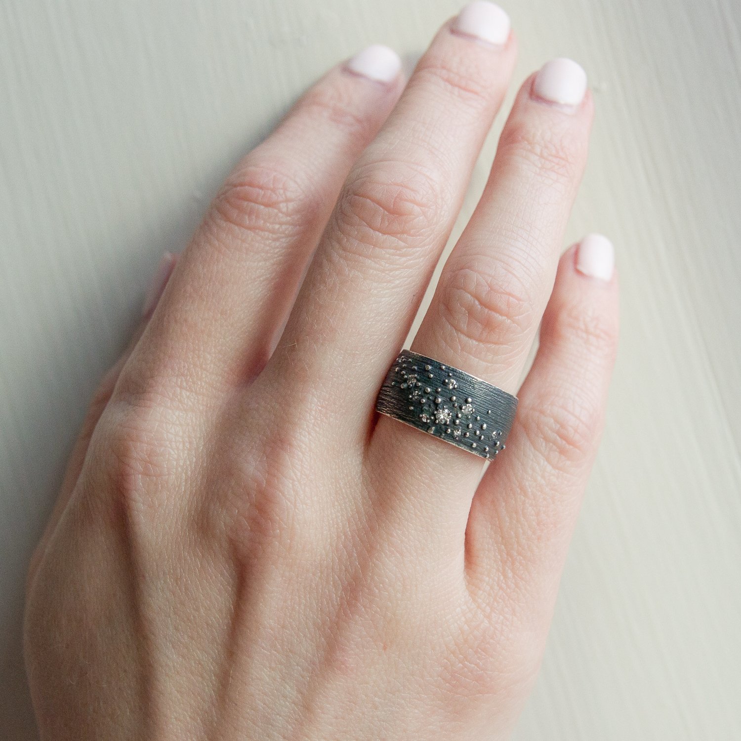 Shaesby: Wide Isla Band Ring in Sterling Silver with .12 TCW White Diamonds