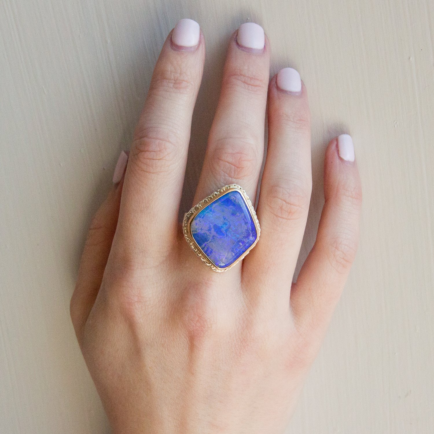 Jamie Joseph: SS and 14k gold ring w/ vertical asymmetrical boulder opal on lava platform and live edge band
