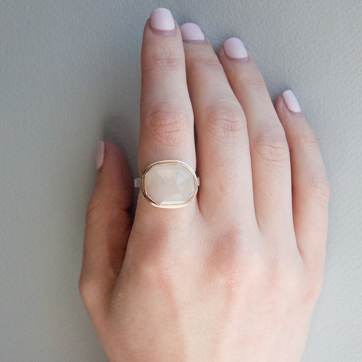 Jamie Joseph: SS & 14k gold ring w/ asymmetrical faceted linen sapphire on medium live edge band