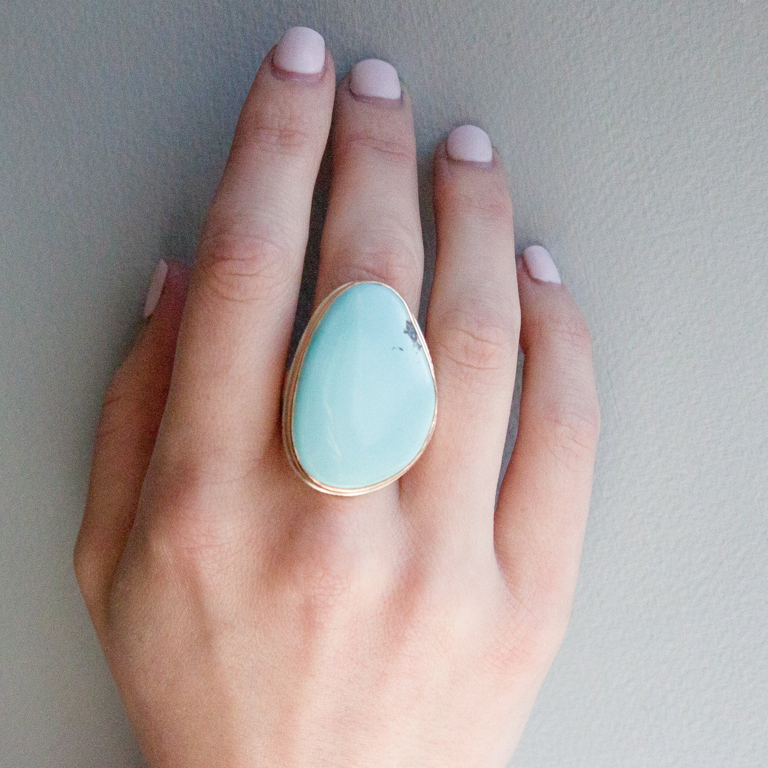 Jamie Joseph: SS & 14k gold ring w/ large vertical asymmetrical smooth blue nevada turquoise on rough hewn band