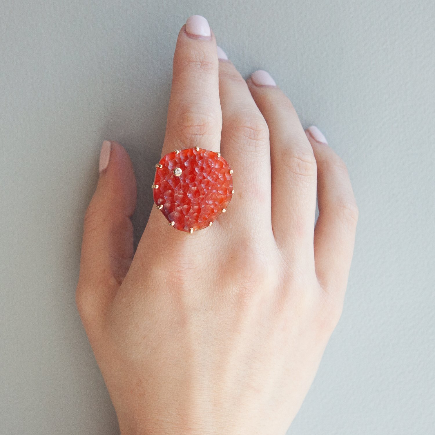 Jamie Joseph: SS & 14k Gold multi prong ring with large vertical asymmetrical surface carnelian & .03 ct diamond on open back reeded platform