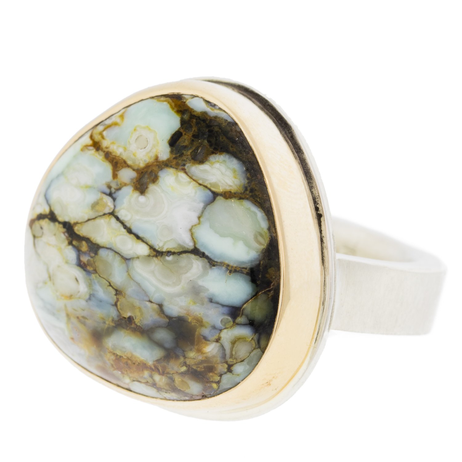 Jamie Joseph: SS &14k gold ring with asymmetrical seven dwarf mineral on y band