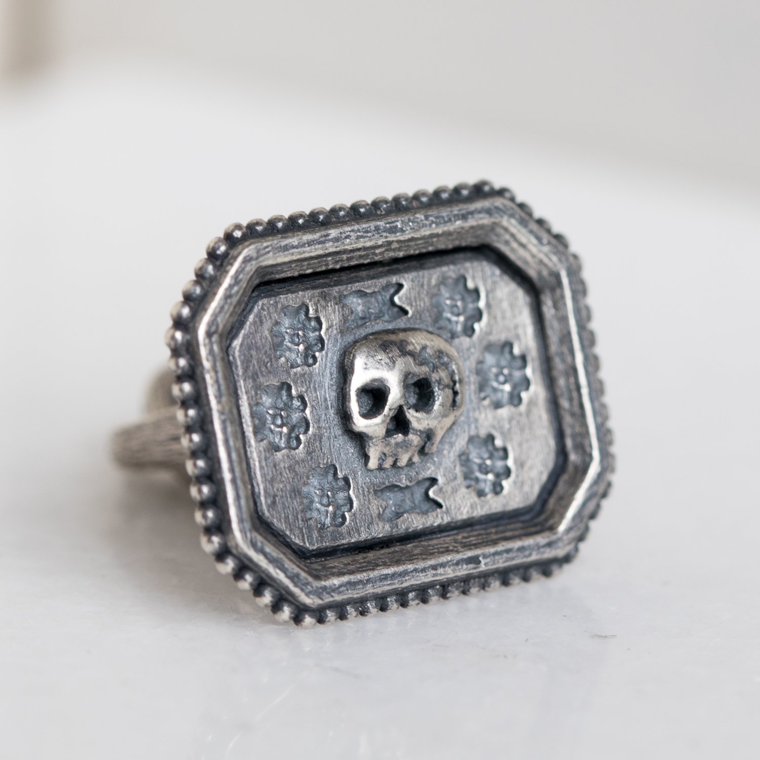 Erica Molinari Trunk Show: SS granule fob w/ skull and flowers
