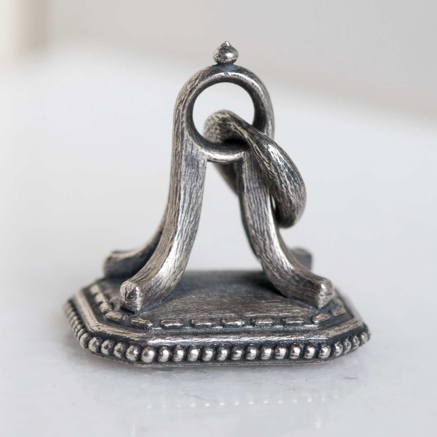 Erica Molinari Trunk Show: SS granule fob w/ skull and flowers