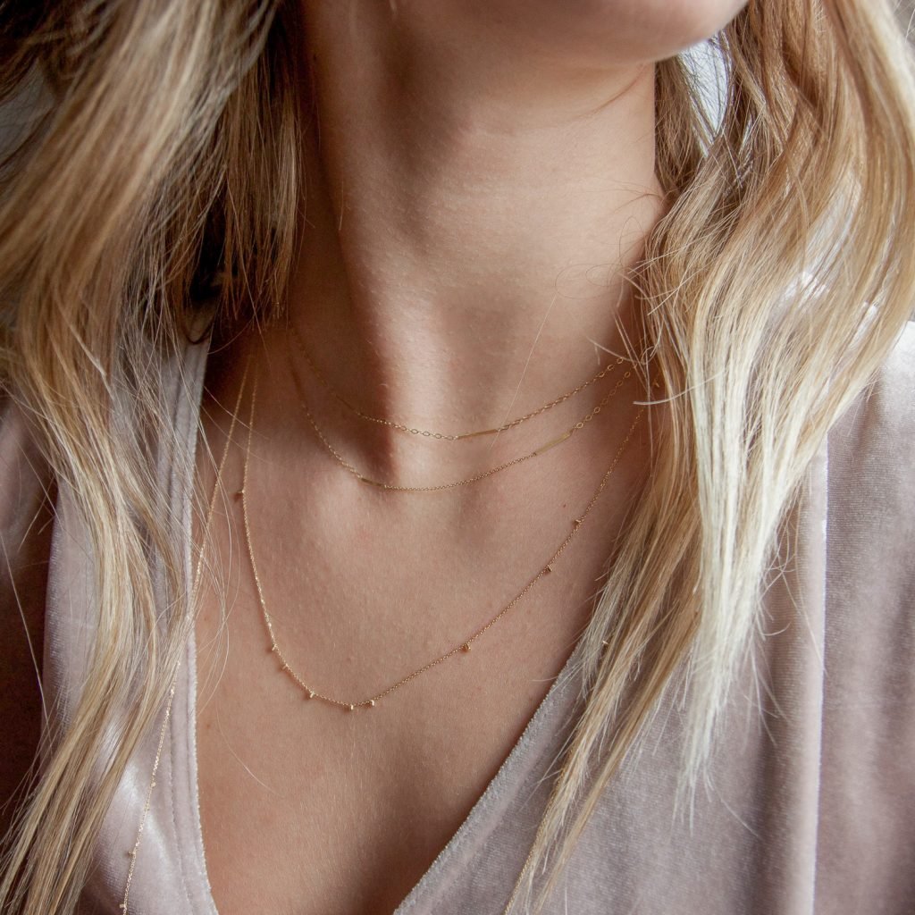 Long gold dust necklace by Sweet Pea