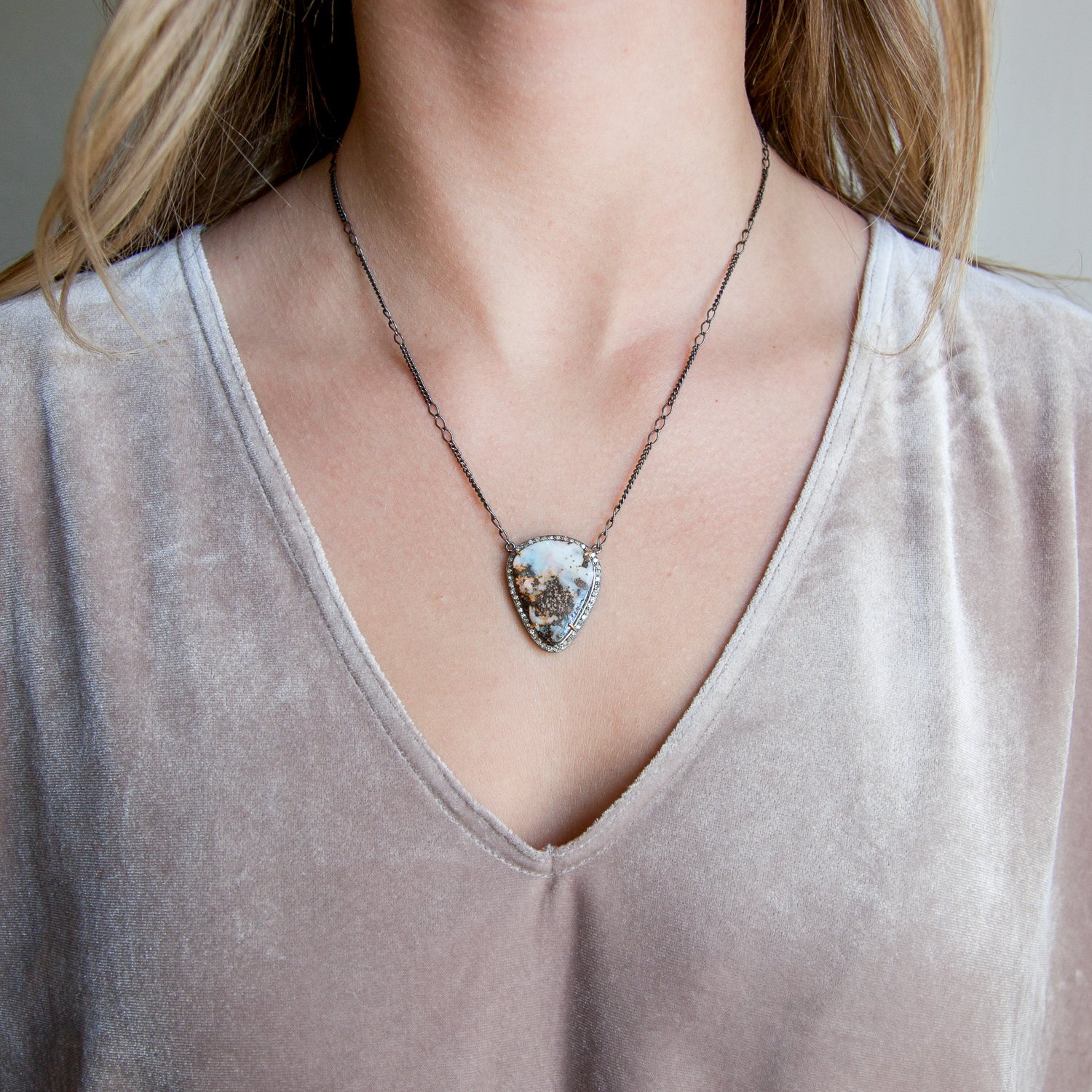 Robindira Unsworth: Black rhodium plated SS, champagne pave diamonds, 14k gold prongs, boulder opal