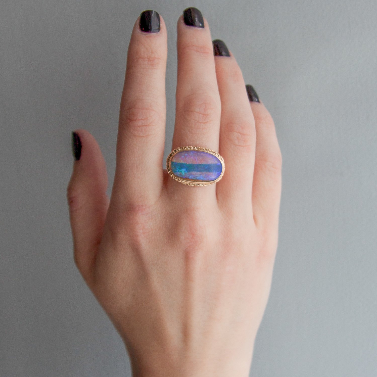 Jamie Joseph:14k Gold Ring w/ oval opalized wood on ruffled platform/delicate facet band