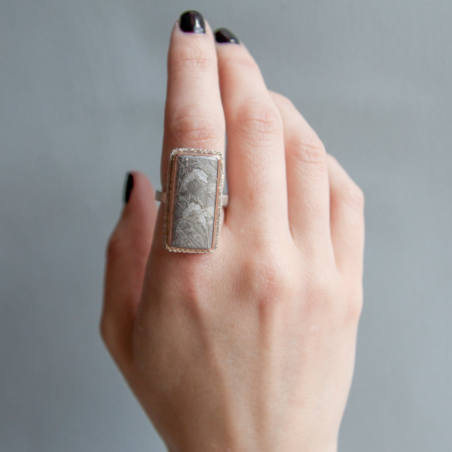 Jamie Joseph: SS and 14k Rose Gold Ring w/ rectangular scrimshaw meteorite on lava platform/ x band