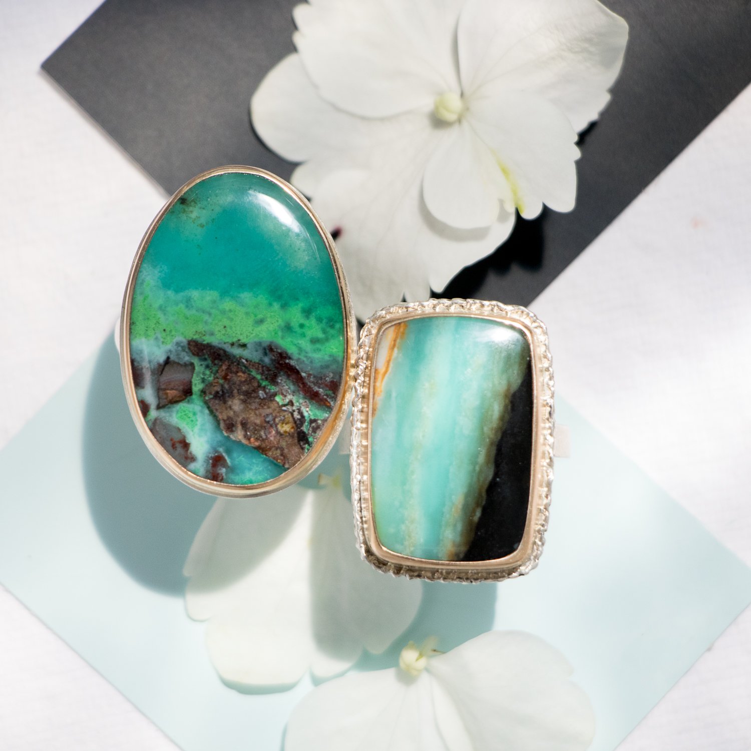 Jamie Joseph: Sterling & 14K gold ring w/vertical rectangular Indonesian Blue Fossilized Opalized Wood on lava platform and X band