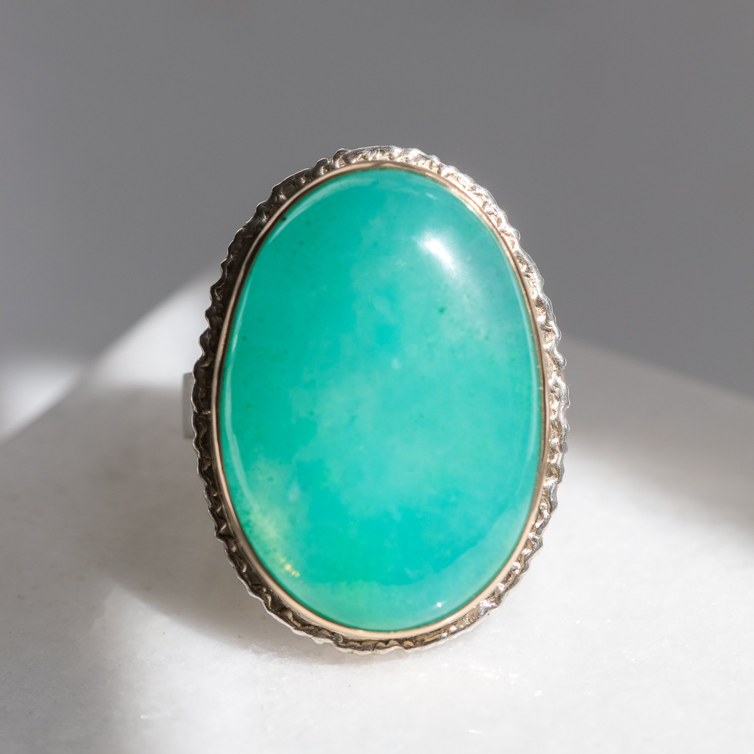 Jamie Joseph: sterling and 14K gold ring w/ large vertical oval gem silica on large platform and Y band