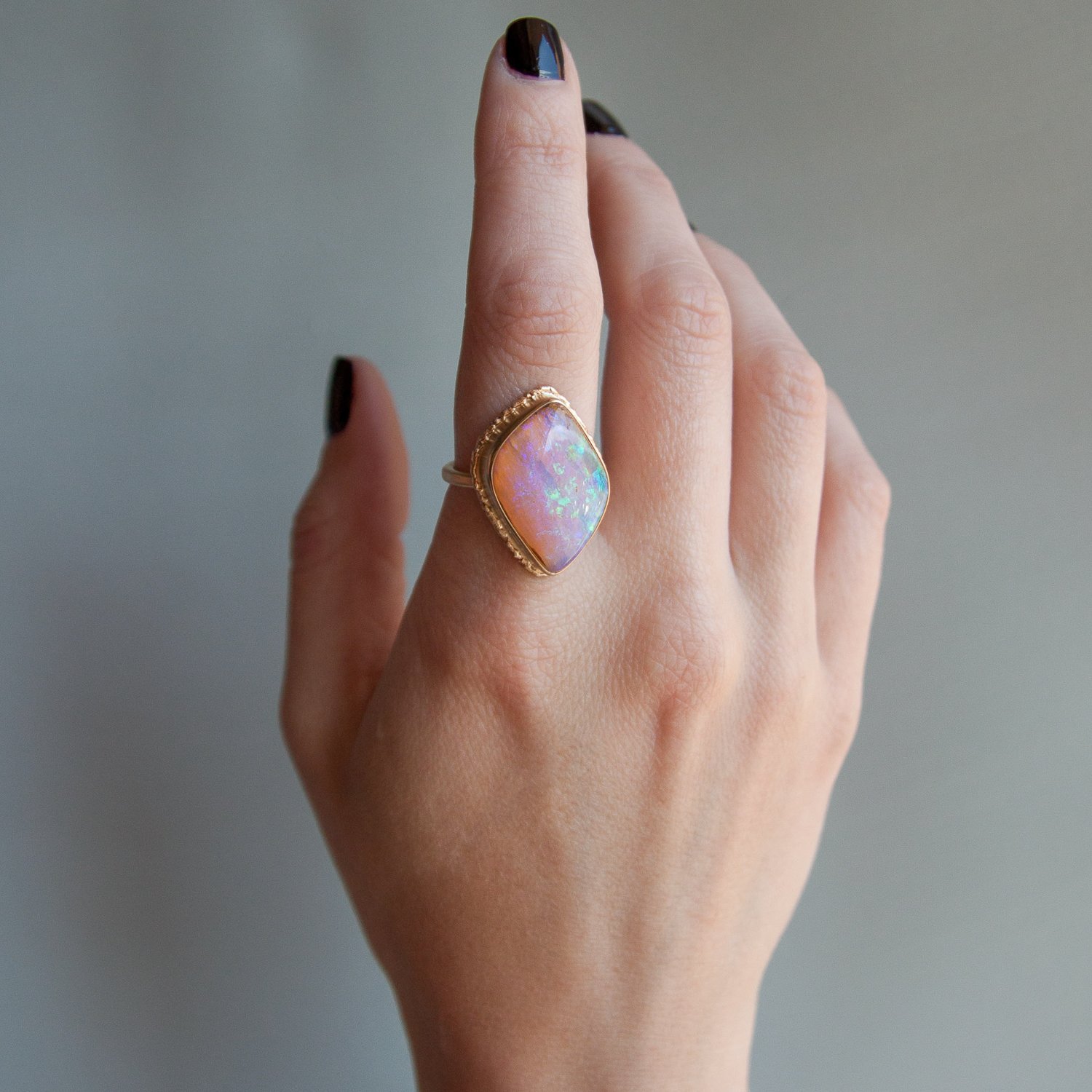 Jamie Joseph: 14k Gold Ring w/ asymmetrical boulder opal on ruffled platform