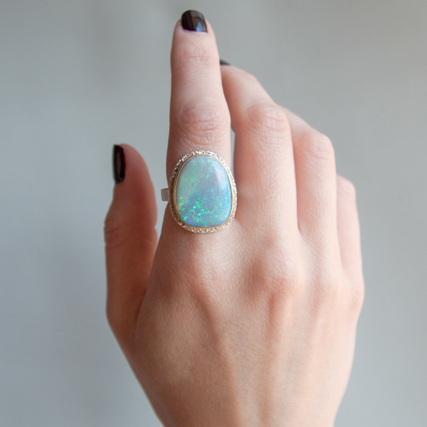 Jamie Joseph: SS and 14k Gold Ring w/ asymmetrical austrailian opal on lava platform and skinny smooth band