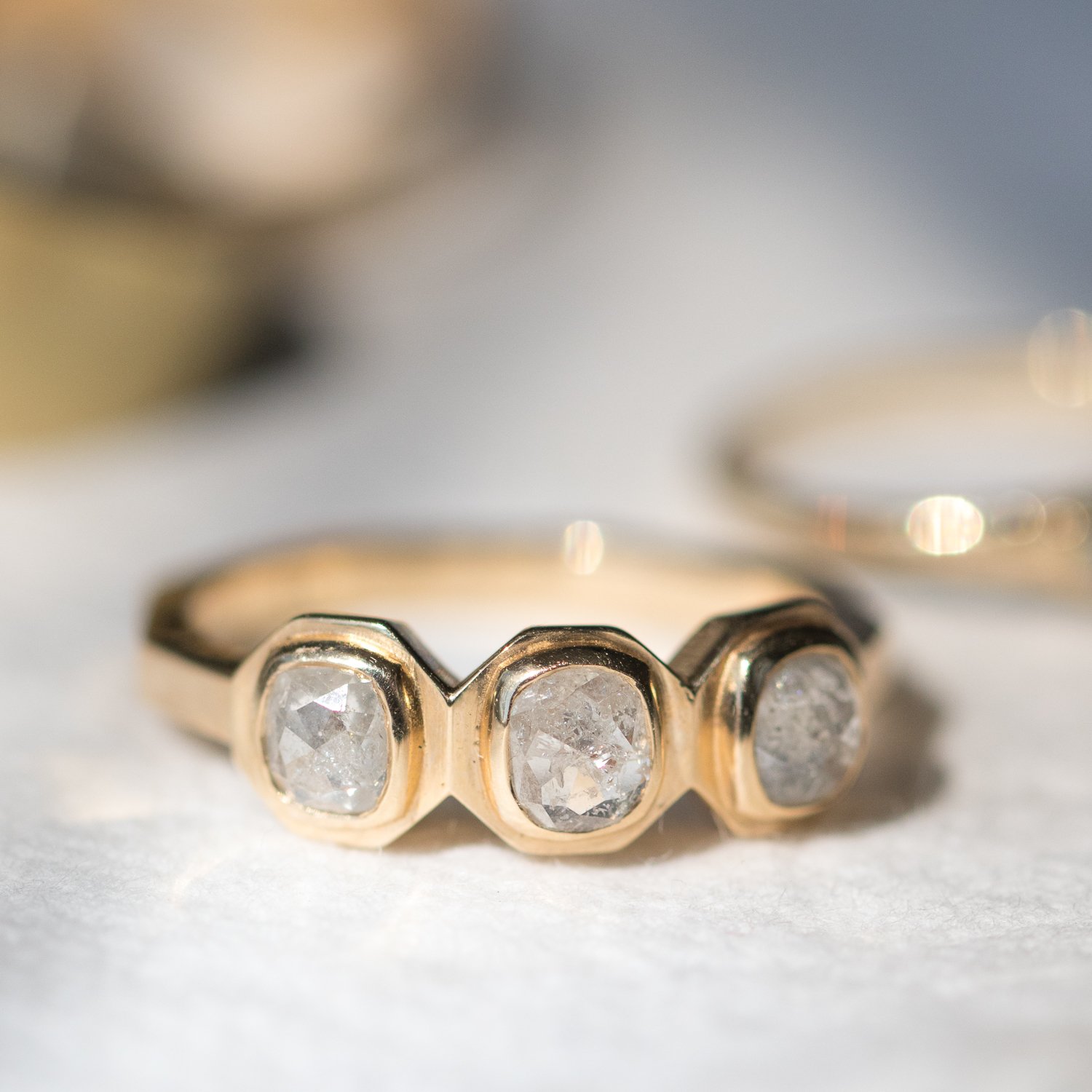 Chinchar/Maloney: TAAL ring in 14K recycled yellow gold with three icy white diamonds .94 TCW
