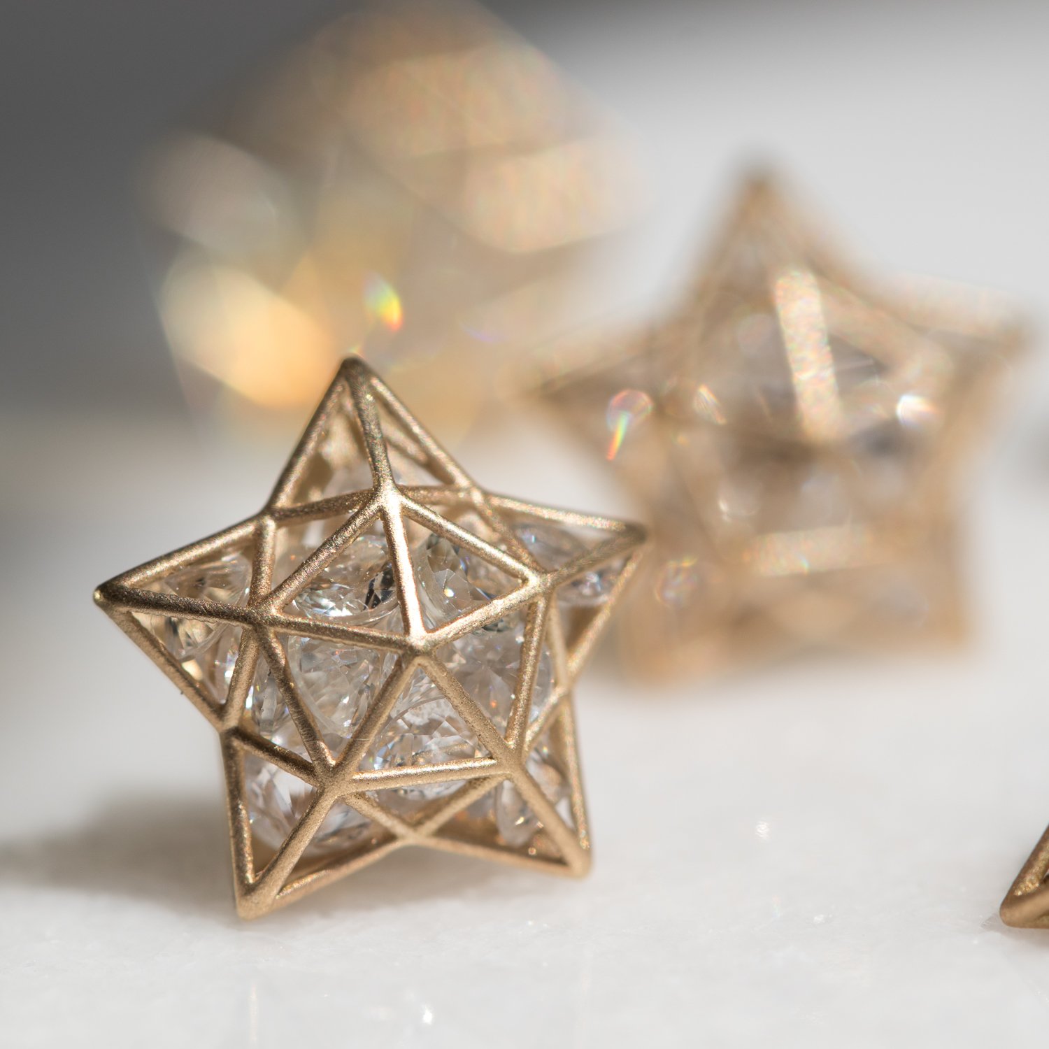 Roulette Star Stud earrings in 18k yellow gold and white sapphires by jewelry designer Roule & Co at NEWTWIST