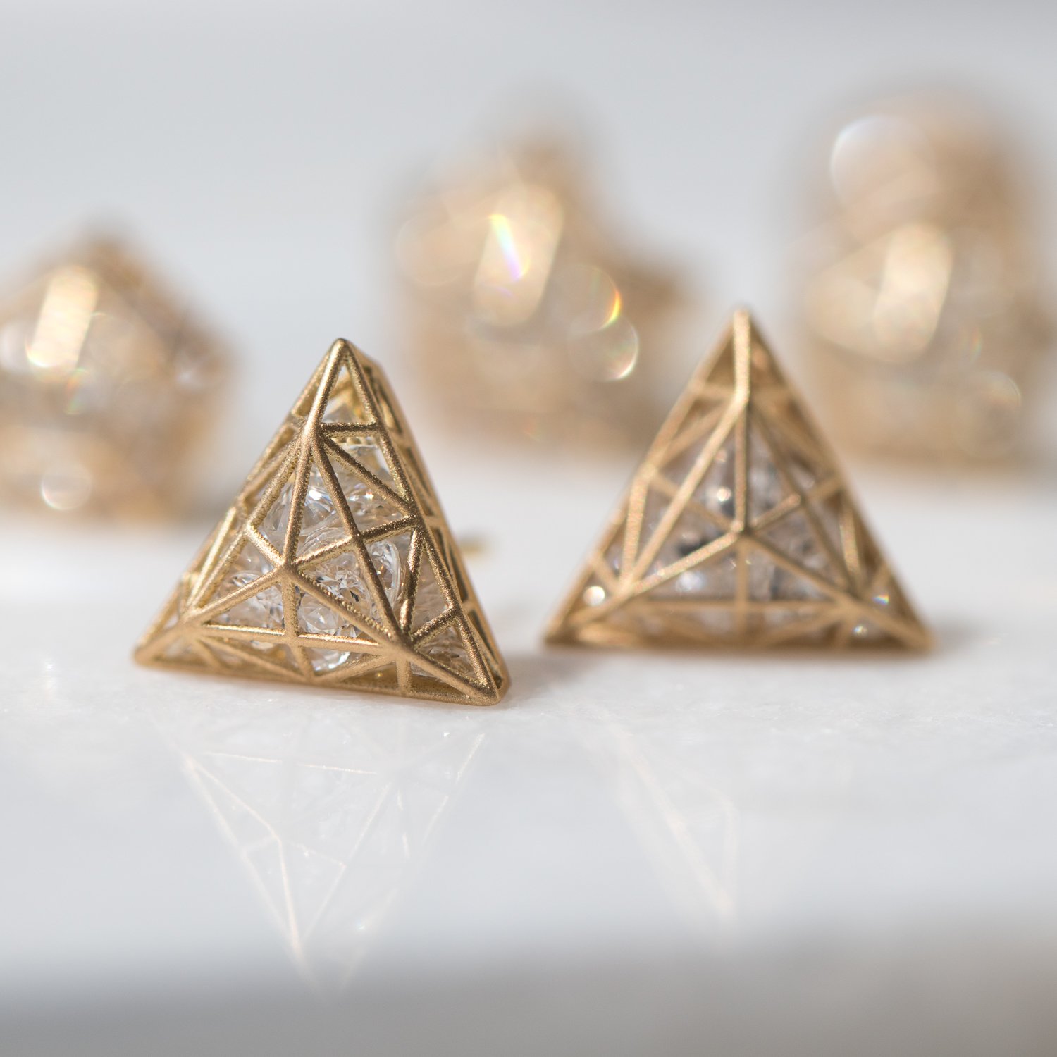 Roulette Triangle Stud Earrings in 18k yellow gold and white sapphires by jewelry designer Roule & Co